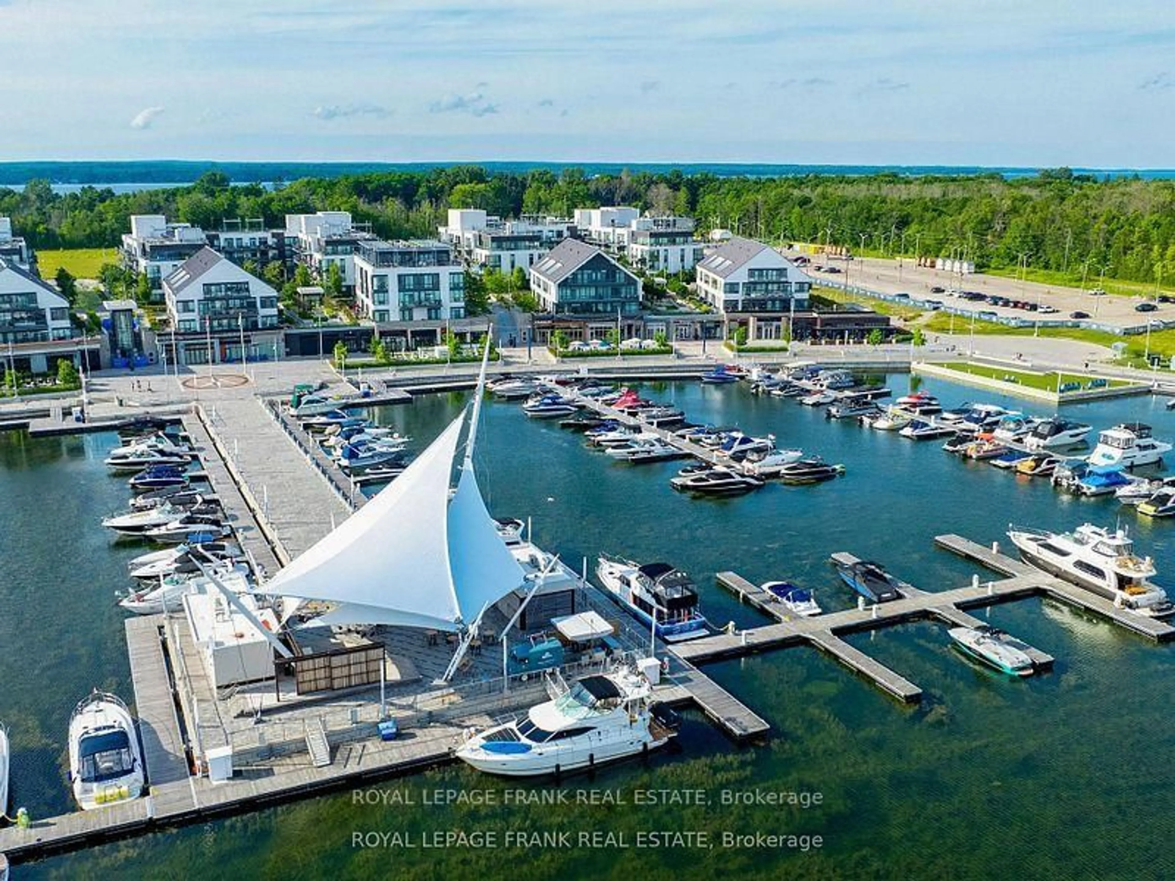 A pic from outside/outdoor area/front of a property/back of a property/a pic from drone, water/lake/river/ocean view for 333 Sea Ray Ave ##D313, Innisfil Ontario L9S 2P7