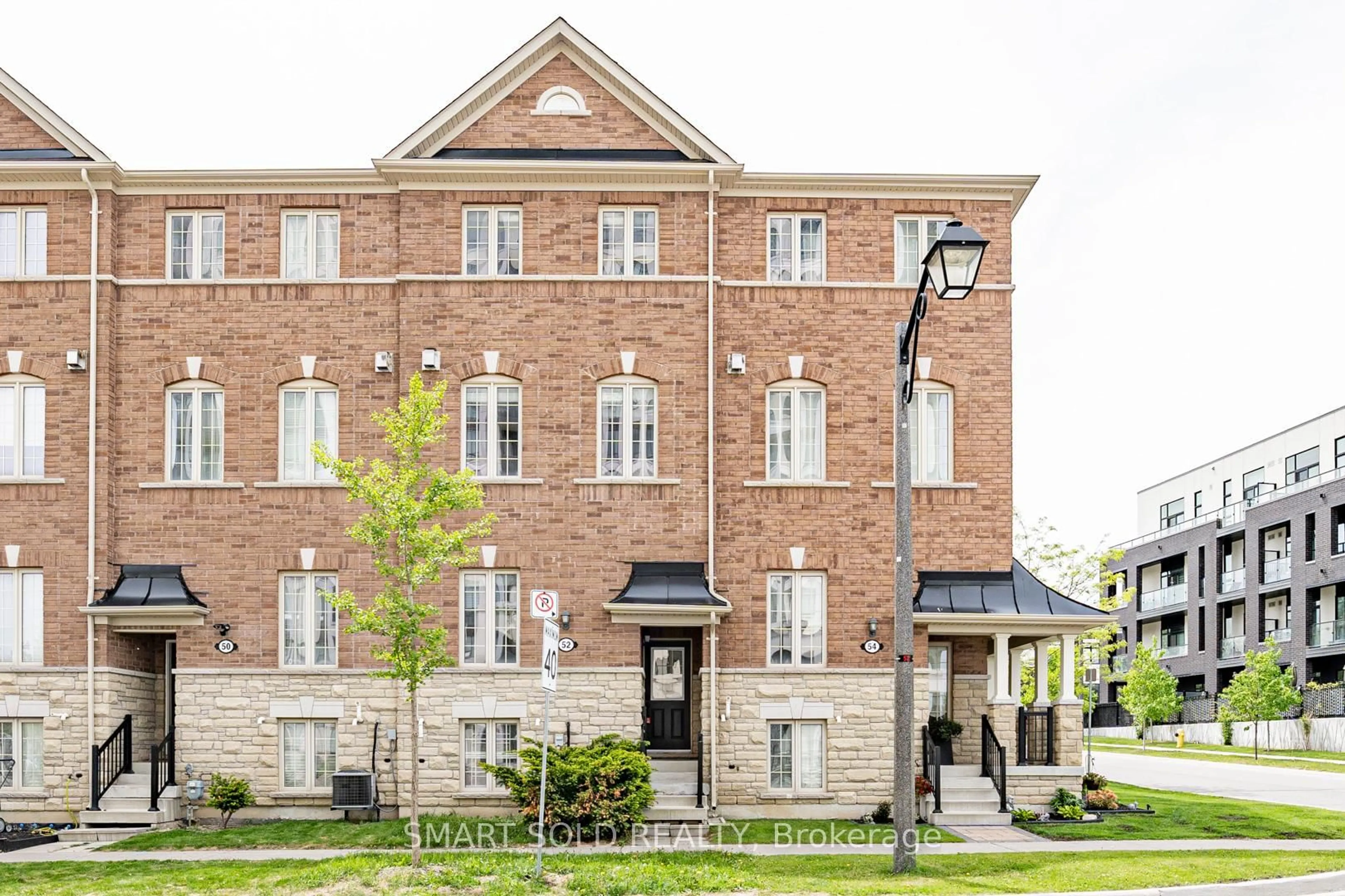 Home with brick exterior material, street for 52 Orca Dr, Markham Ontario L6E 0R6