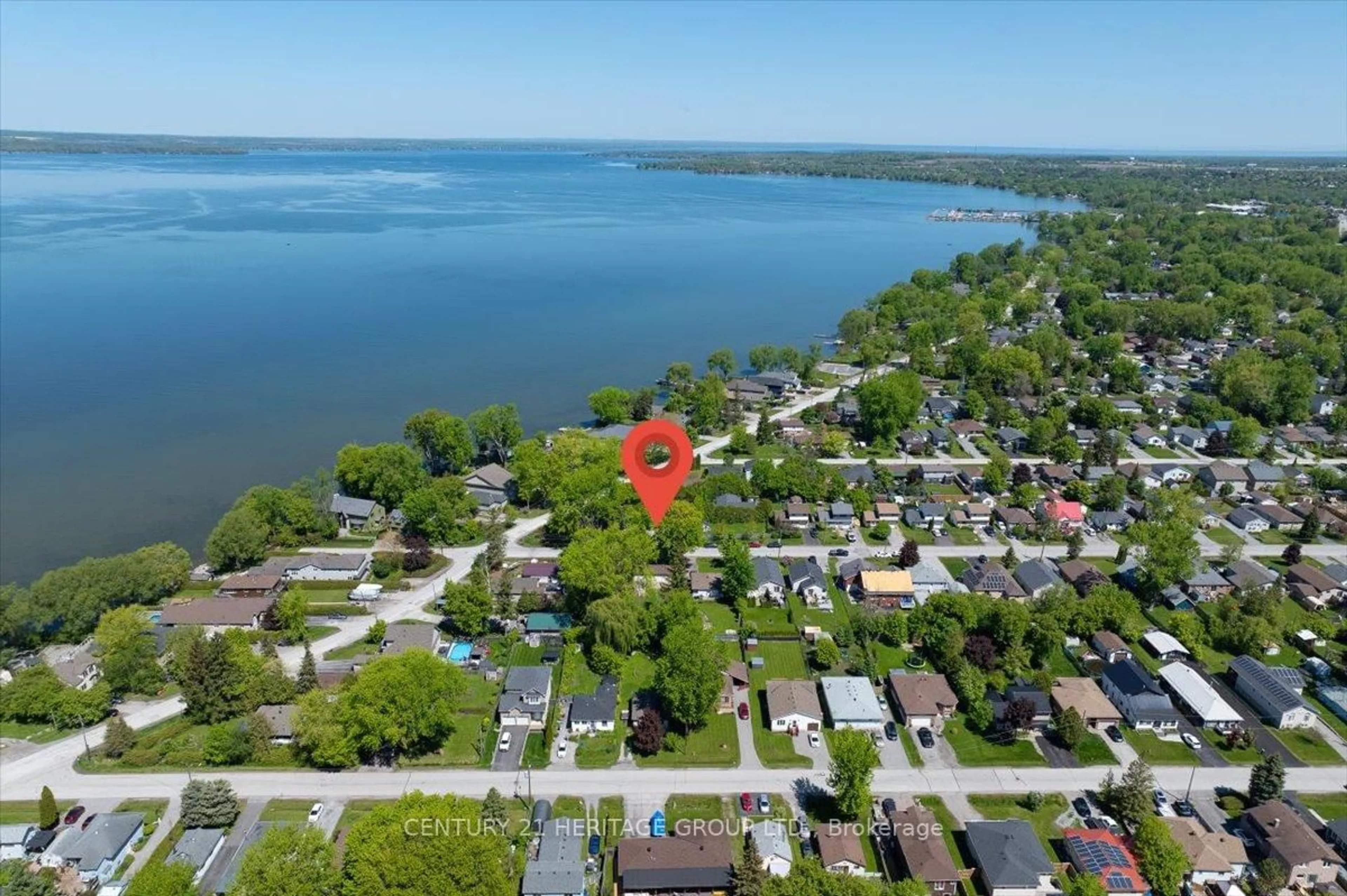 A pic from outside/outdoor area/front of a property/back of a property/a pic from drone, water/lake/river/ocean view for 307 Glenwoods Ave, Georgina Ontario L4P 2X1