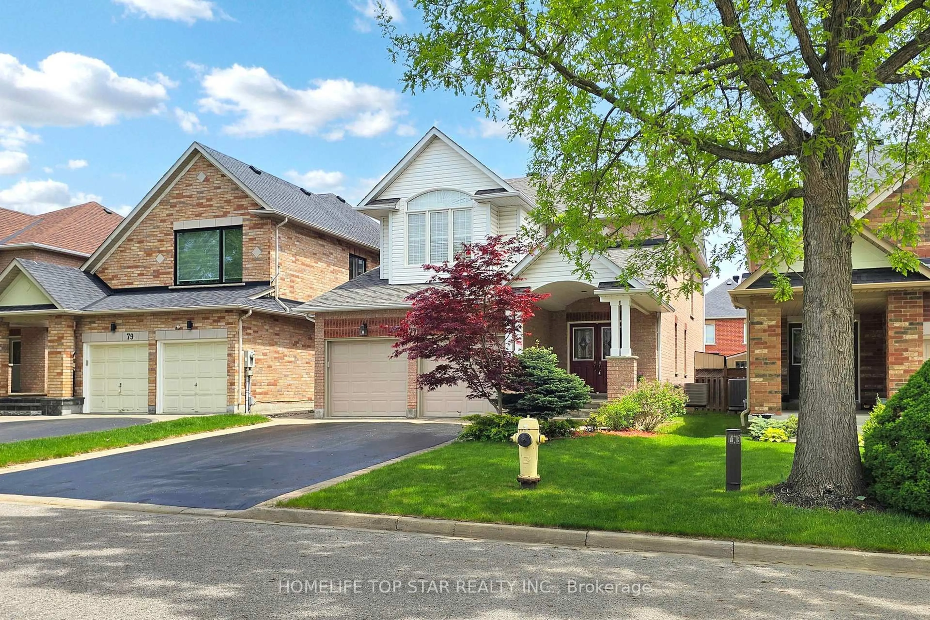 Home with brick exterior material, street for 77 Red Ash Dr, Markham Ontario L3S 4L2