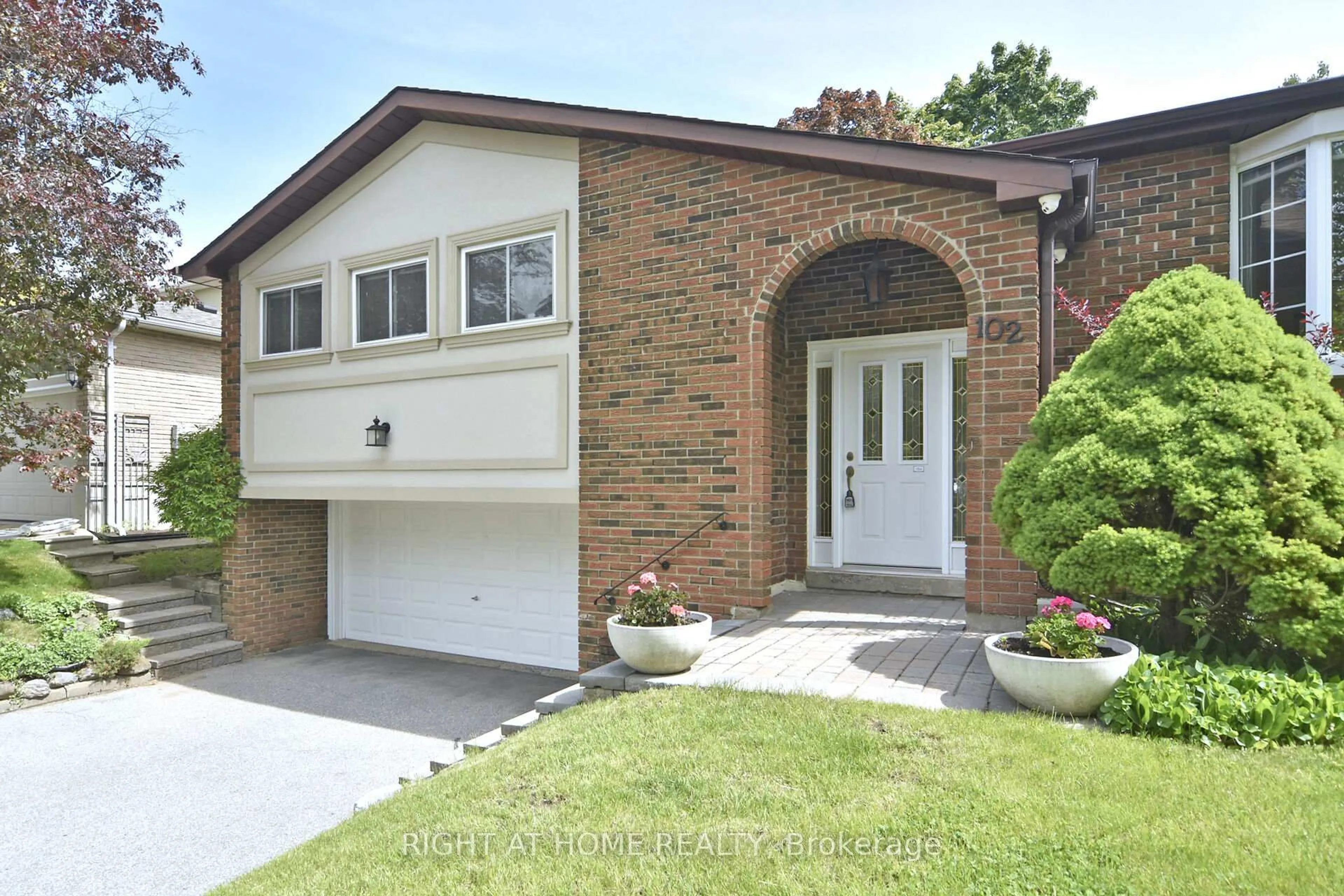 Home with brick exterior material, street for 102 Romfield Crct, Markham Ontario L3T 3H6