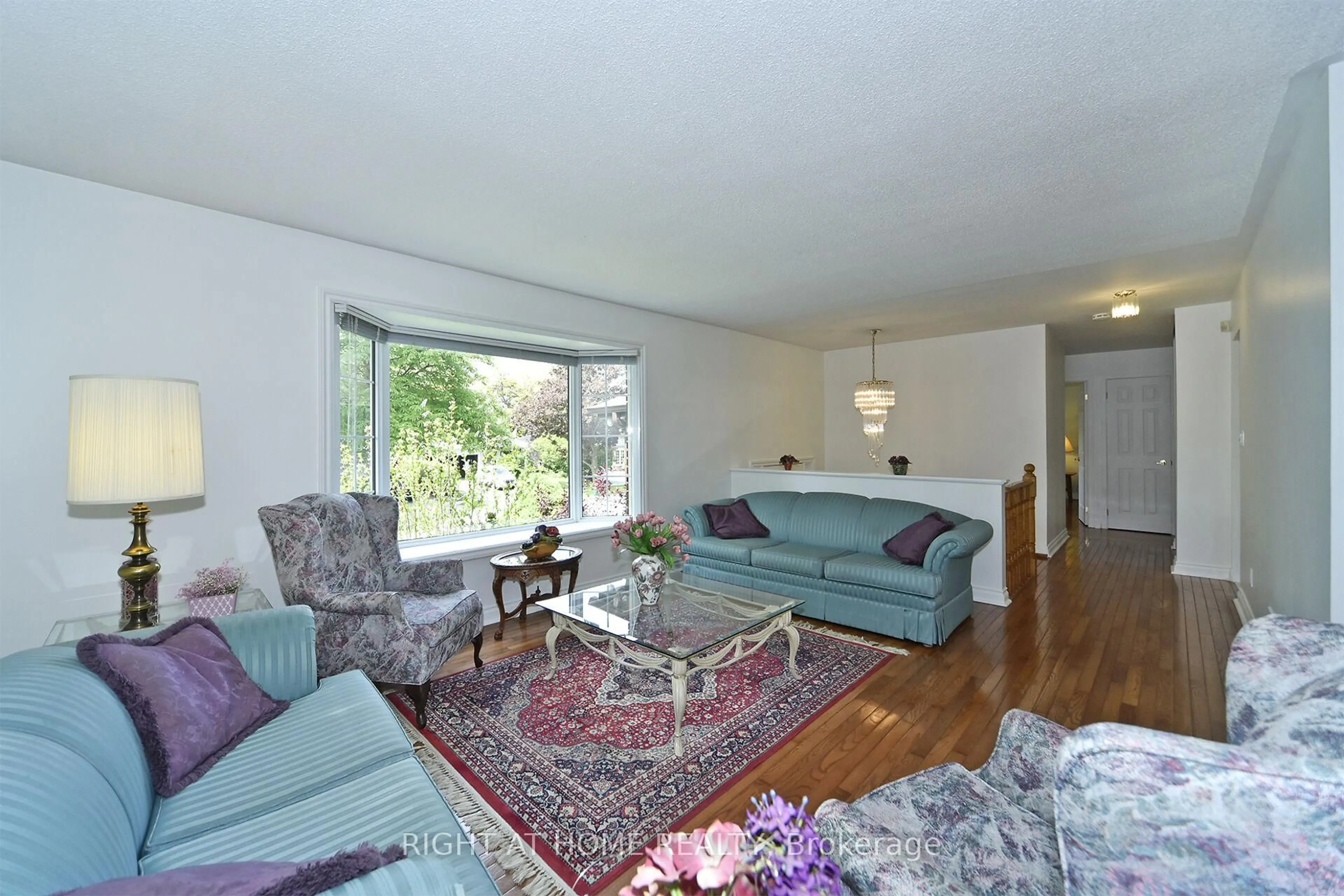 Living room with furniture, unknown for 102 Romfield Crct, Markham Ontario L3T 3H6