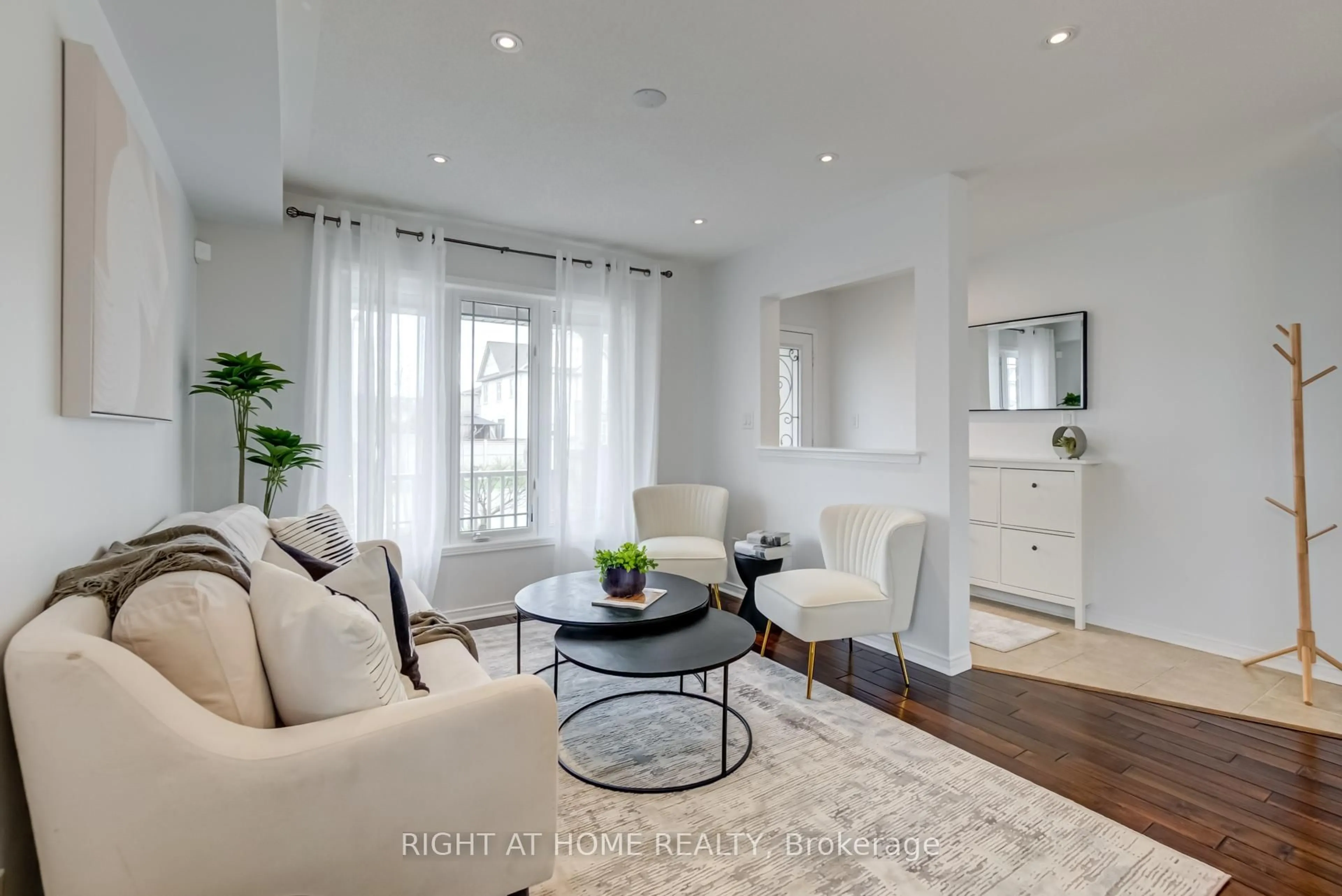 Living room with furniture, wood/laminate floor for 829 Miller Park Ave, Bradford West Gwillimbury Ontario L3Z 0L7