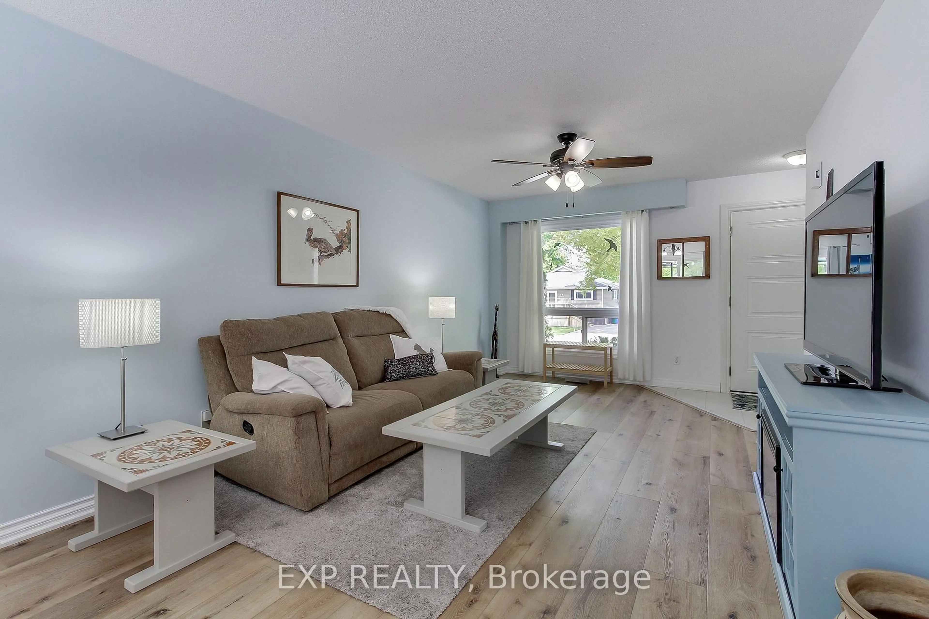 Living room with furniture, wood/laminate floor for 267 Cedarholme Ave, Georgina Ontario L4P 2W5