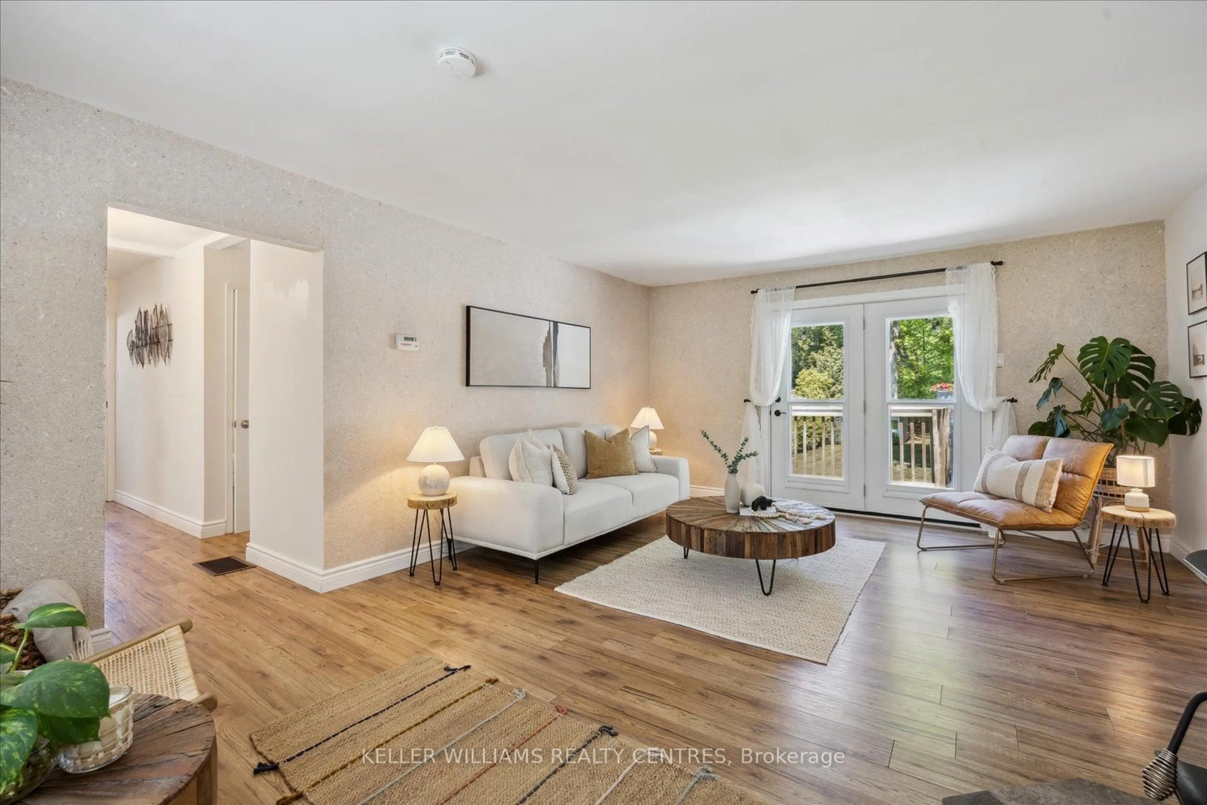 Living room with furniture, wood/laminate floor for 26 Evans Ave, Georgina Ontario L0E 1R0