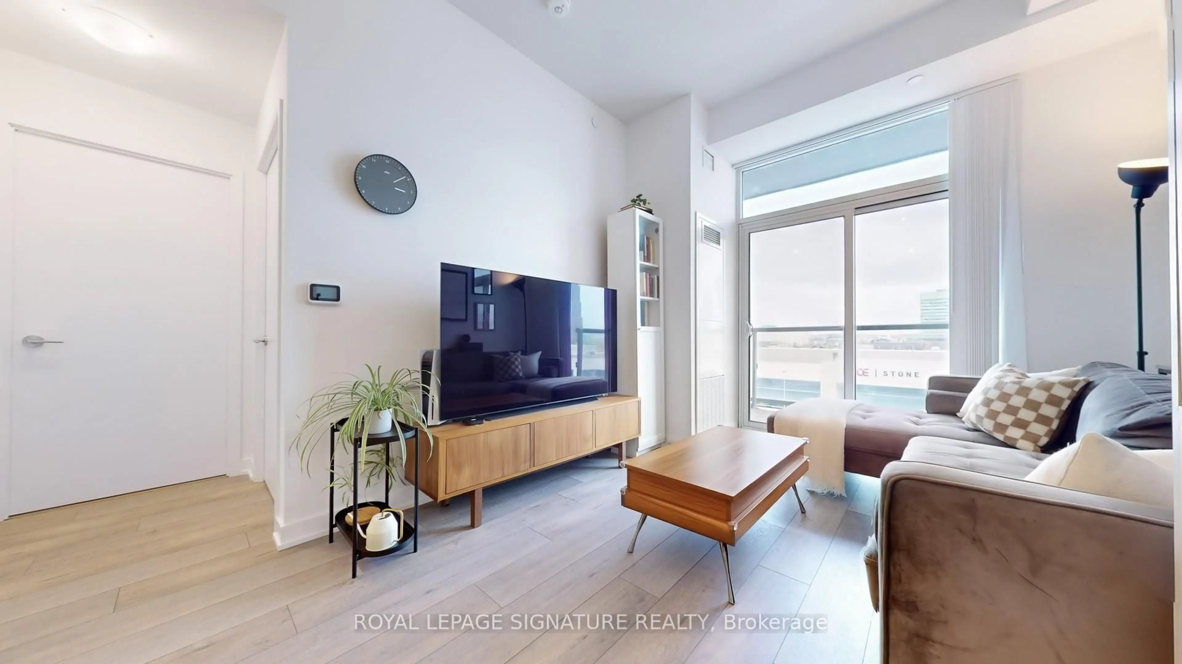 Living room with furniture, wood/laminate floor for 38 Honeycrisp Cres #522, Vaughan Ontario L4K 0M8