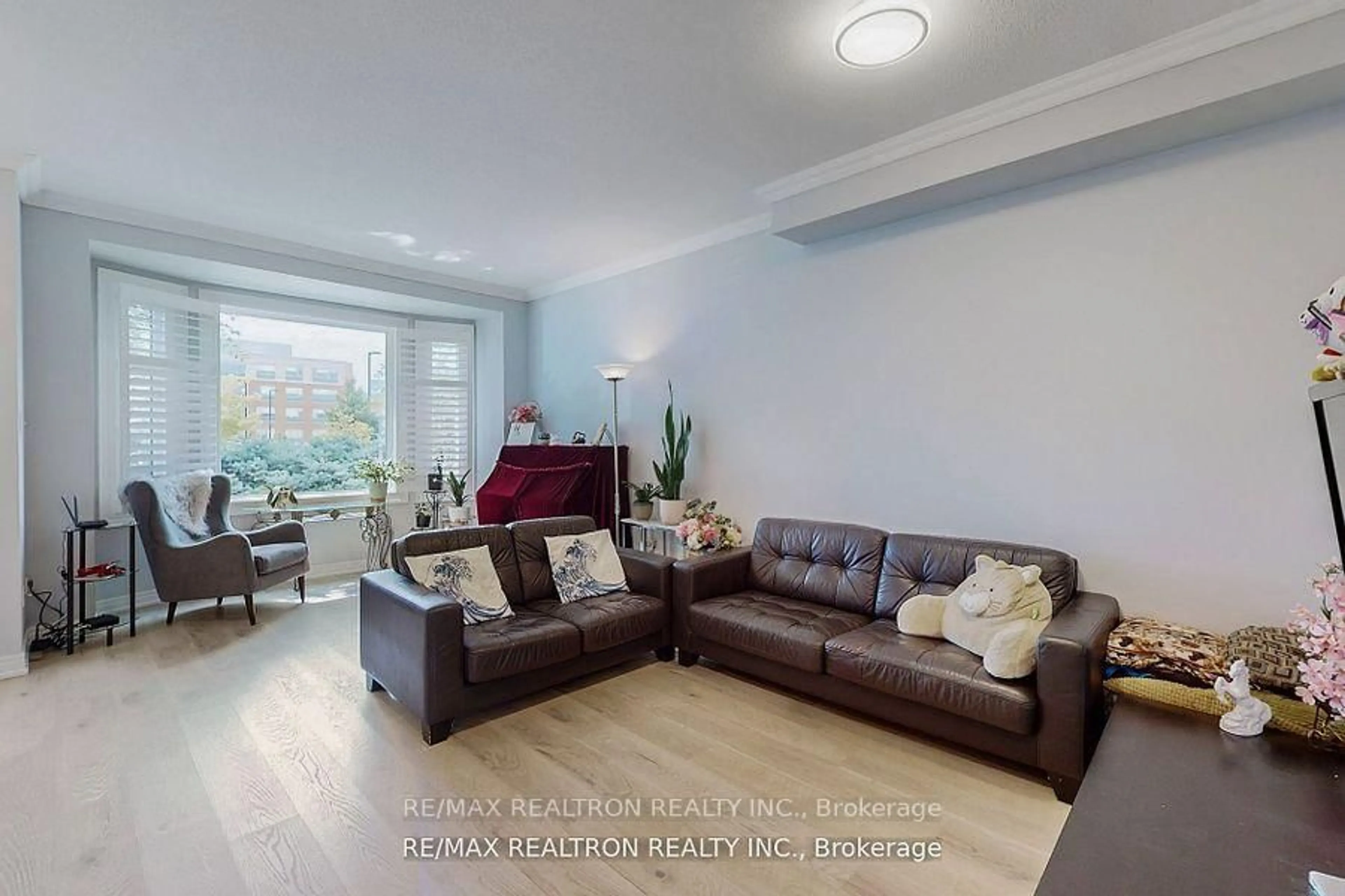 Living room with furniture, wood/laminate floor for 110 Riverlands Ave, Markham Ontario L6B 1B6