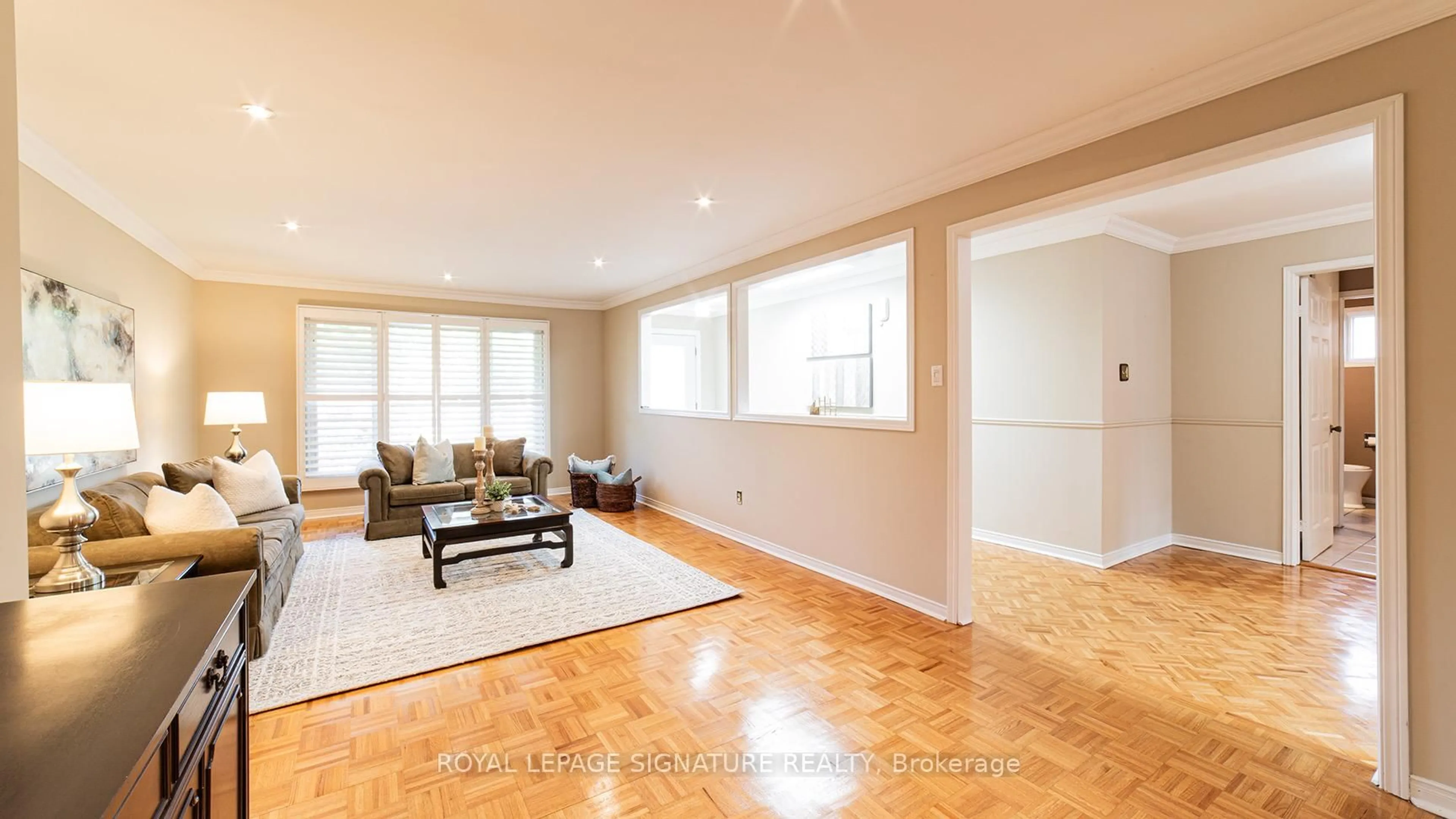 Living room with furniture, wood/laminate floor for 69 Harvest Moon Dr, Markham Ontario L3R 4L3