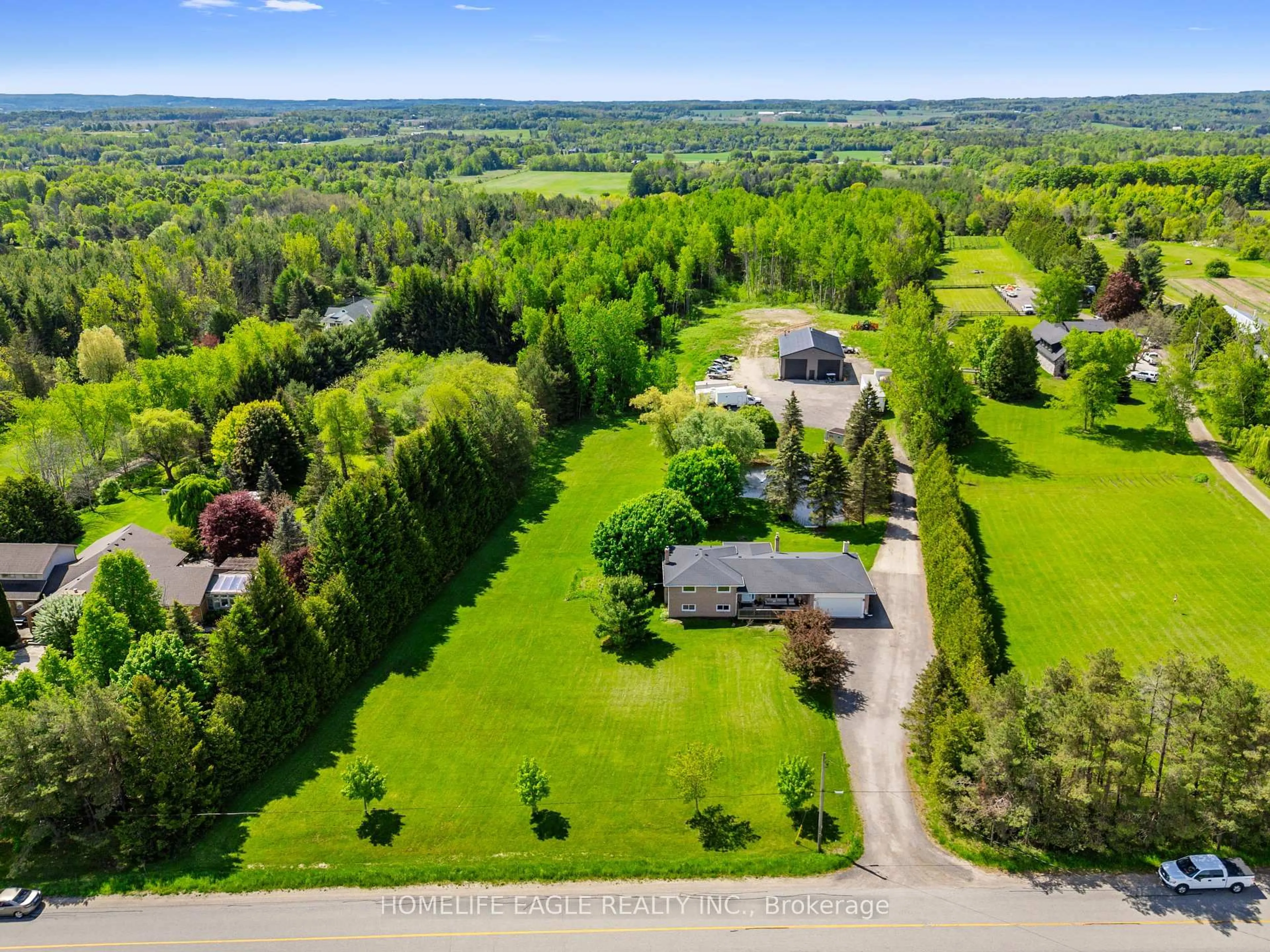 A pic from outside/outdoor area/front of a property/back of a property/a pic from drone, unknown for 5657 6th Line, New Tecumseth Ontario L0G 1W0