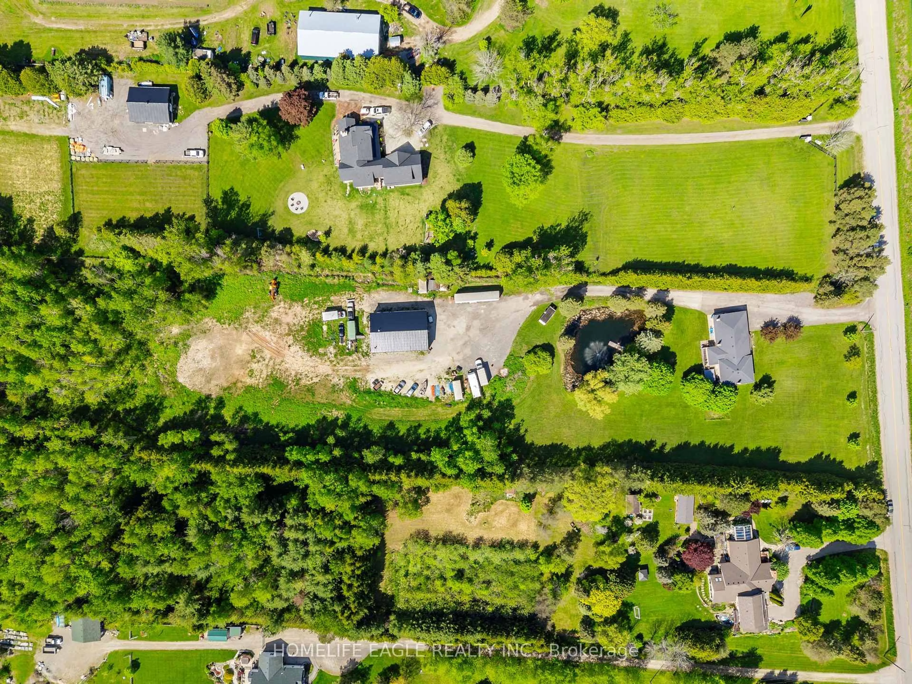 A pic from outside/outdoor area/front of a property/back of a property/a pic from drone, street for 5657 6th Line, New Tecumseth Ontario L0G 1W0