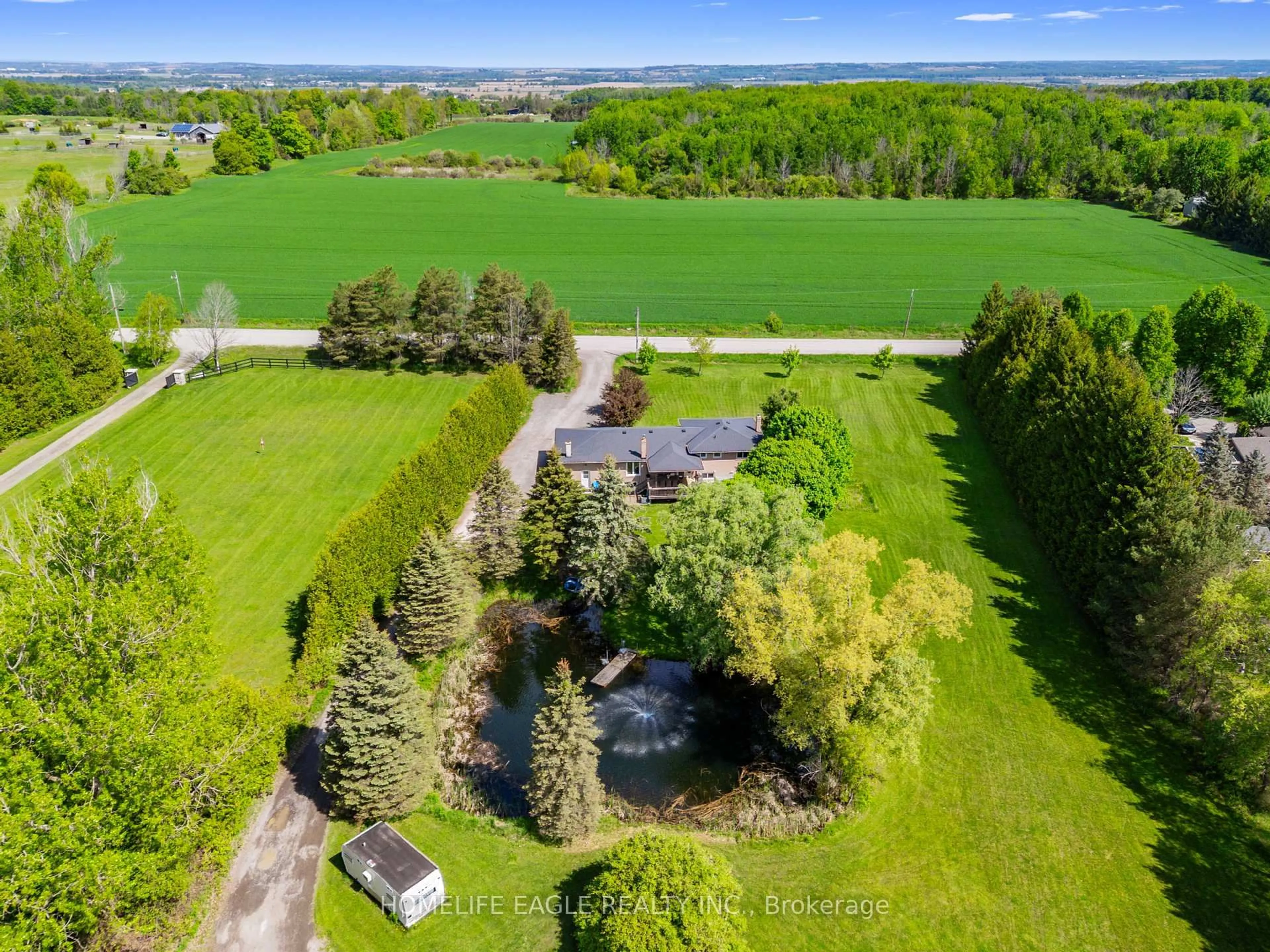 A pic from outside/outdoor area/front of a property/back of a property/a pic from drone, unknown for 5657 6th Line, New Tecumseth Ontario L0G 1W0