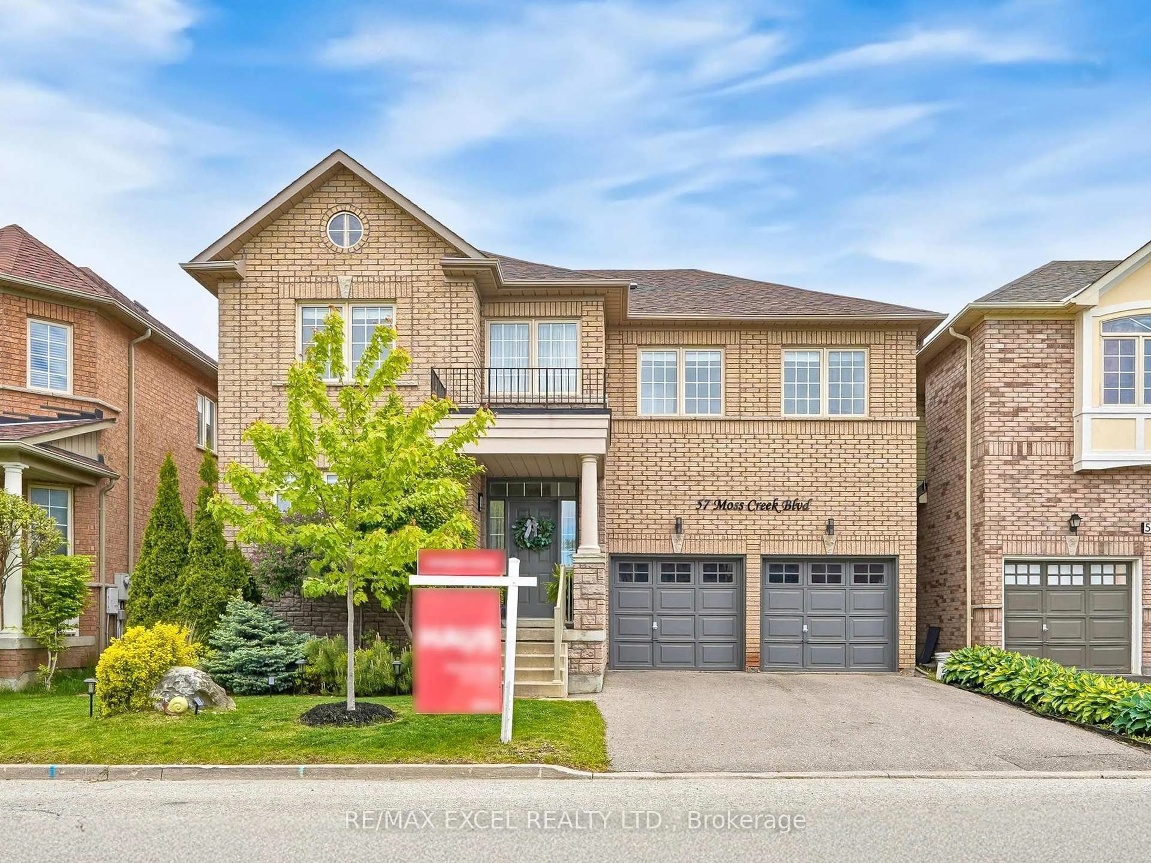 Home with brick exterior material, street for 57 Moss Creek Blvd, Markham Ontario L6C 2V5