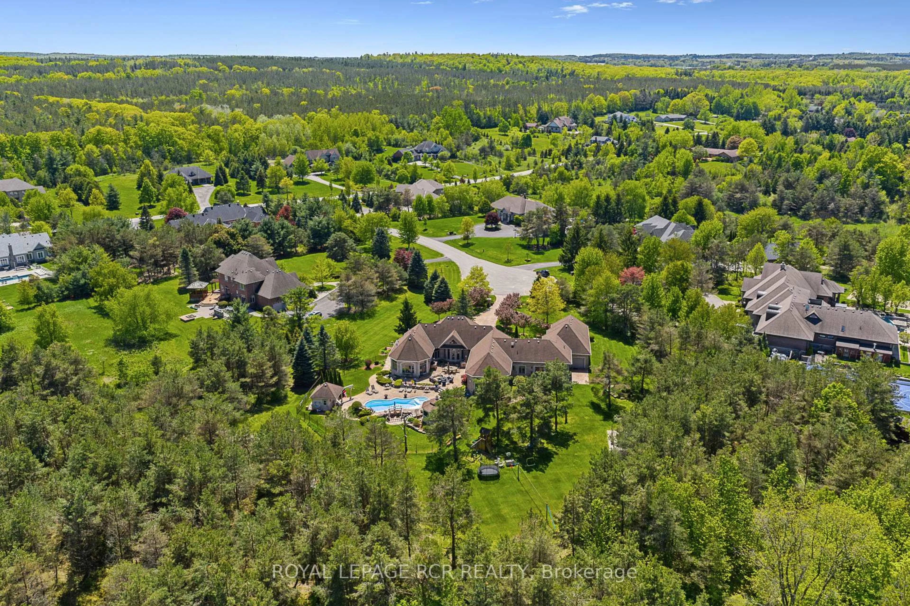 A pic from outside/outdoor area/front of a property/back of a property/a pic from drone, forest/trees view for 7 Sugarbush Lane, Uxbridge Ontario L9P 2A1