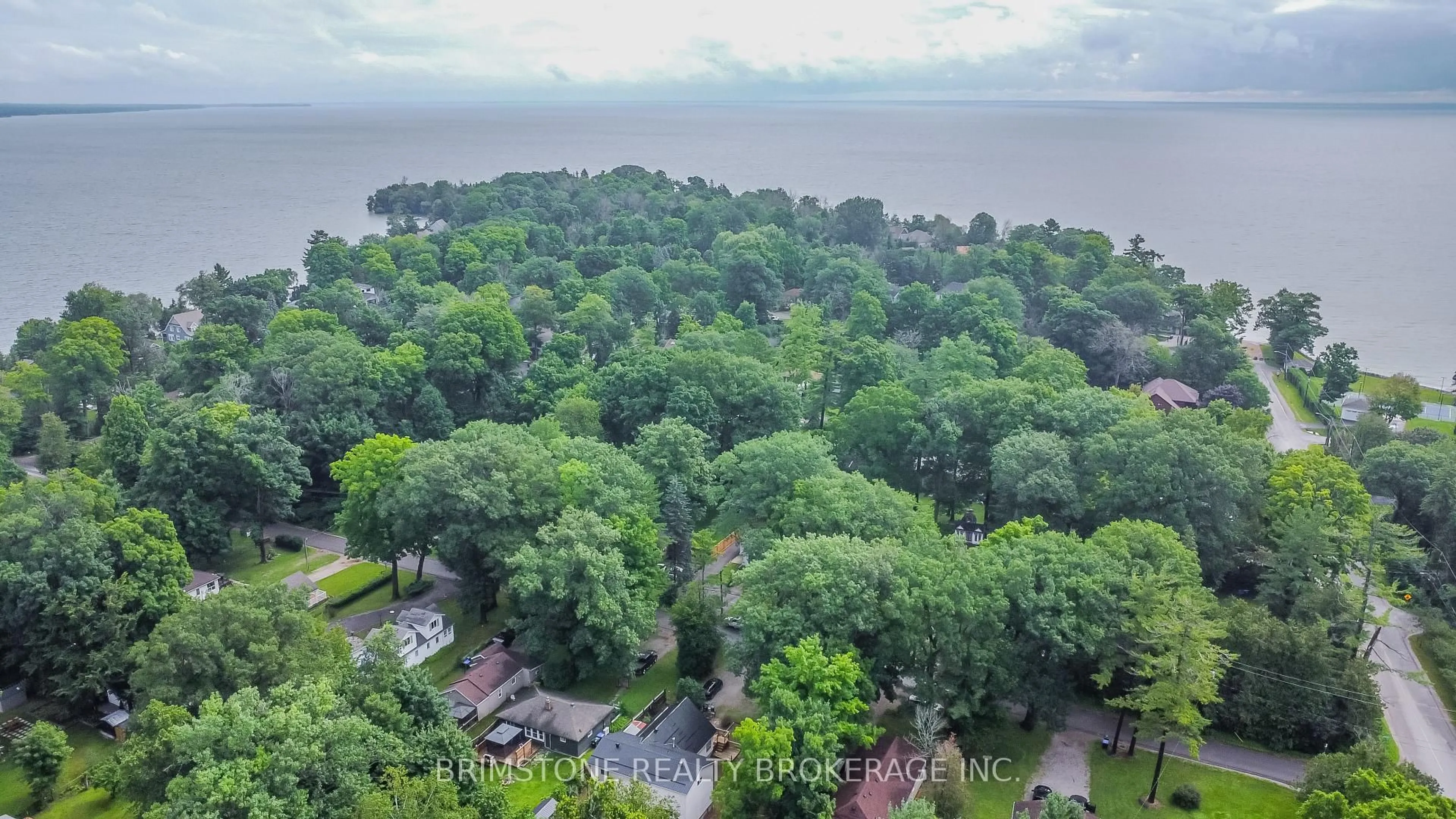 A pic from outside/outdoor area/front of a property/back of a property/a pic from drone, water/lake/river/ocean view for 3923 Algonquin Ave, Innisfil Ontario L9S 2M3