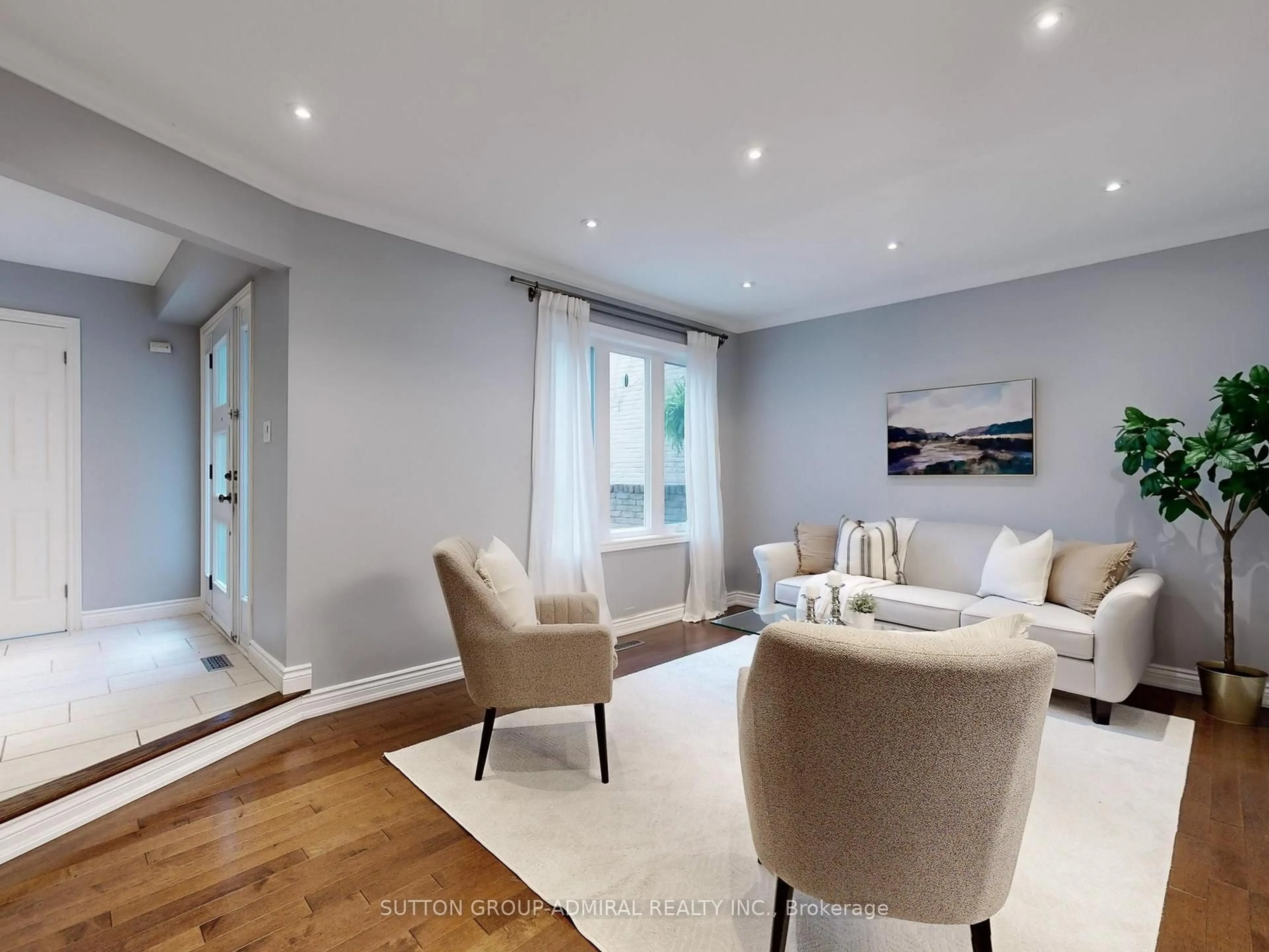 Living room with furniture, wood/laminate floor for 57 Peter Andrew Cres, Vaughan Ontario L4J 3E2