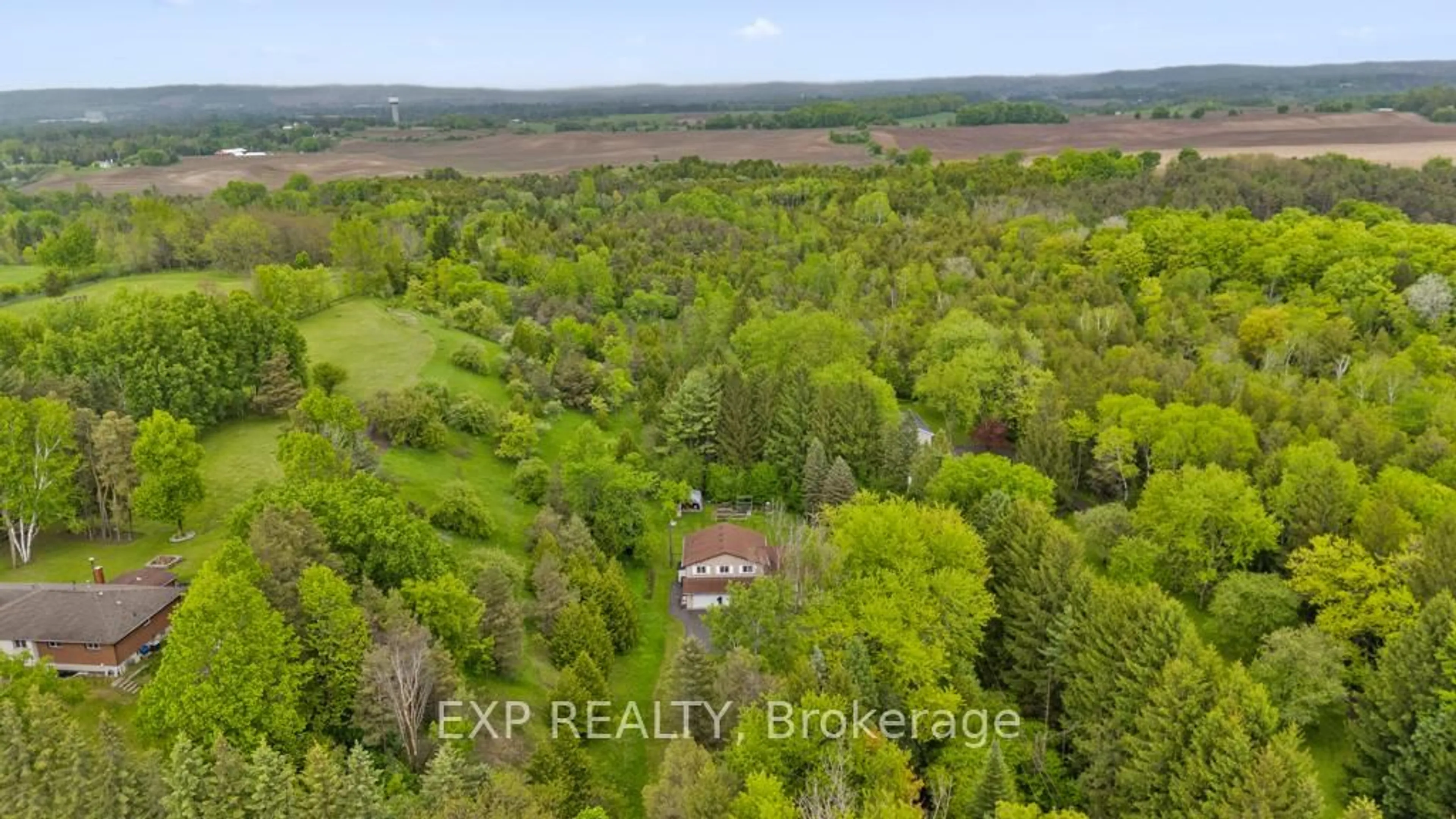 A pic from outside/outdoor area/front of a property/back of a property/a pic from drone, forest/trees view for 1717 Adjala Tecumseth Twn Line, New Tecumseth Ontario L0G 1W0
