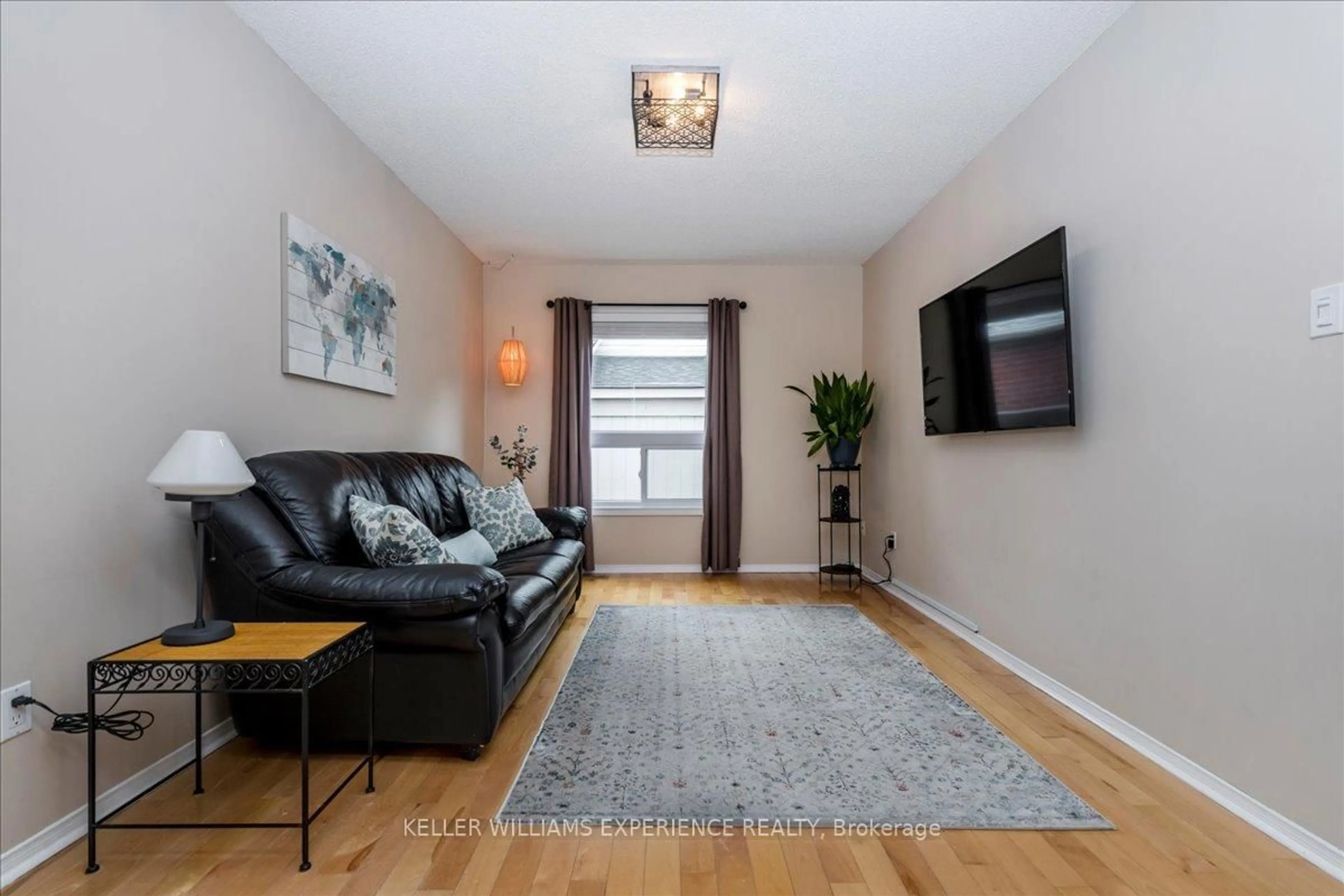 Living room with furniture, wood/laminate floor for 472 Haines St, New Tecumseth Ontario L0G 1A0