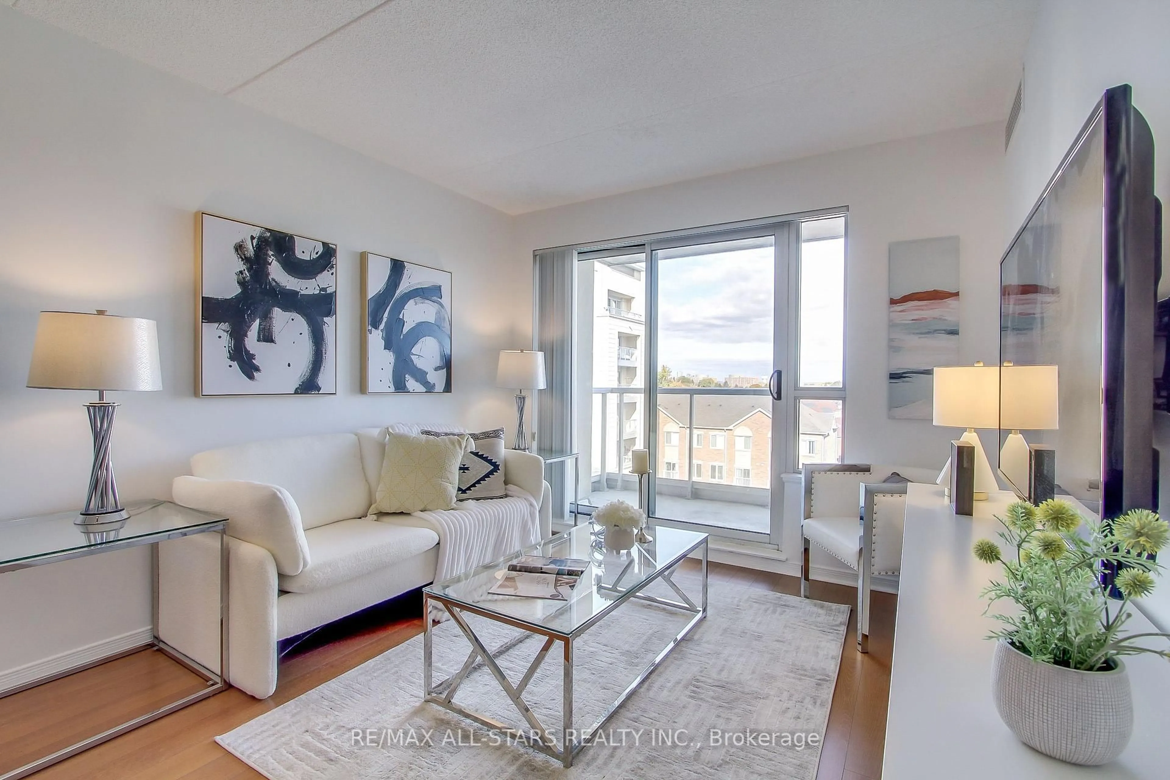 Living room with furniture, wood/laminate floor for 4600 Steeles Ave #610, Markham Ontario L3R 5J1