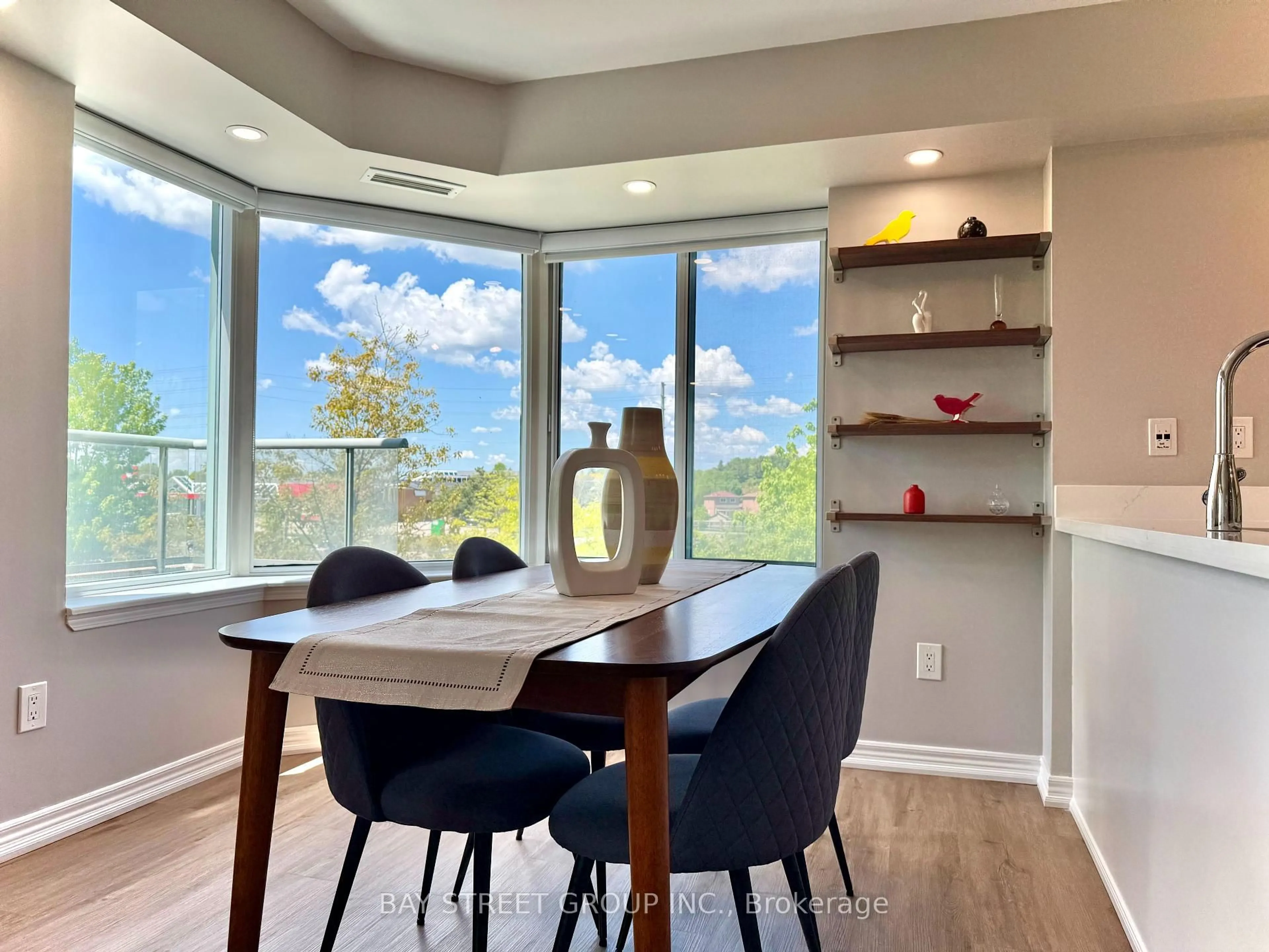 Dining room, wood/laminate floor for 135 Pond Dr #308, Markham Ontario L3T 7V6