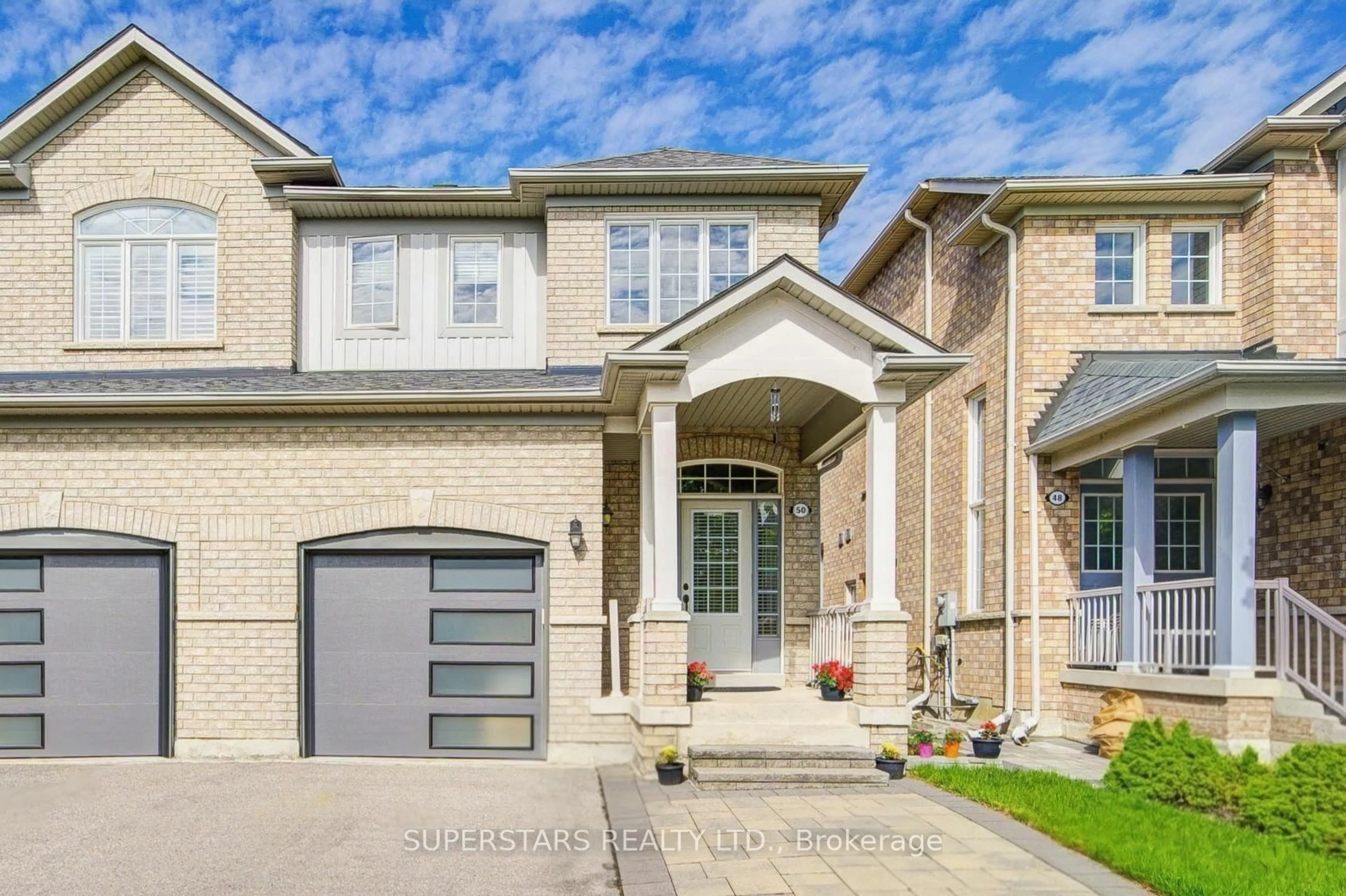 Home with brick exterior material, street for 50 Macadam Rd, Markham Ontario L6E 2C1