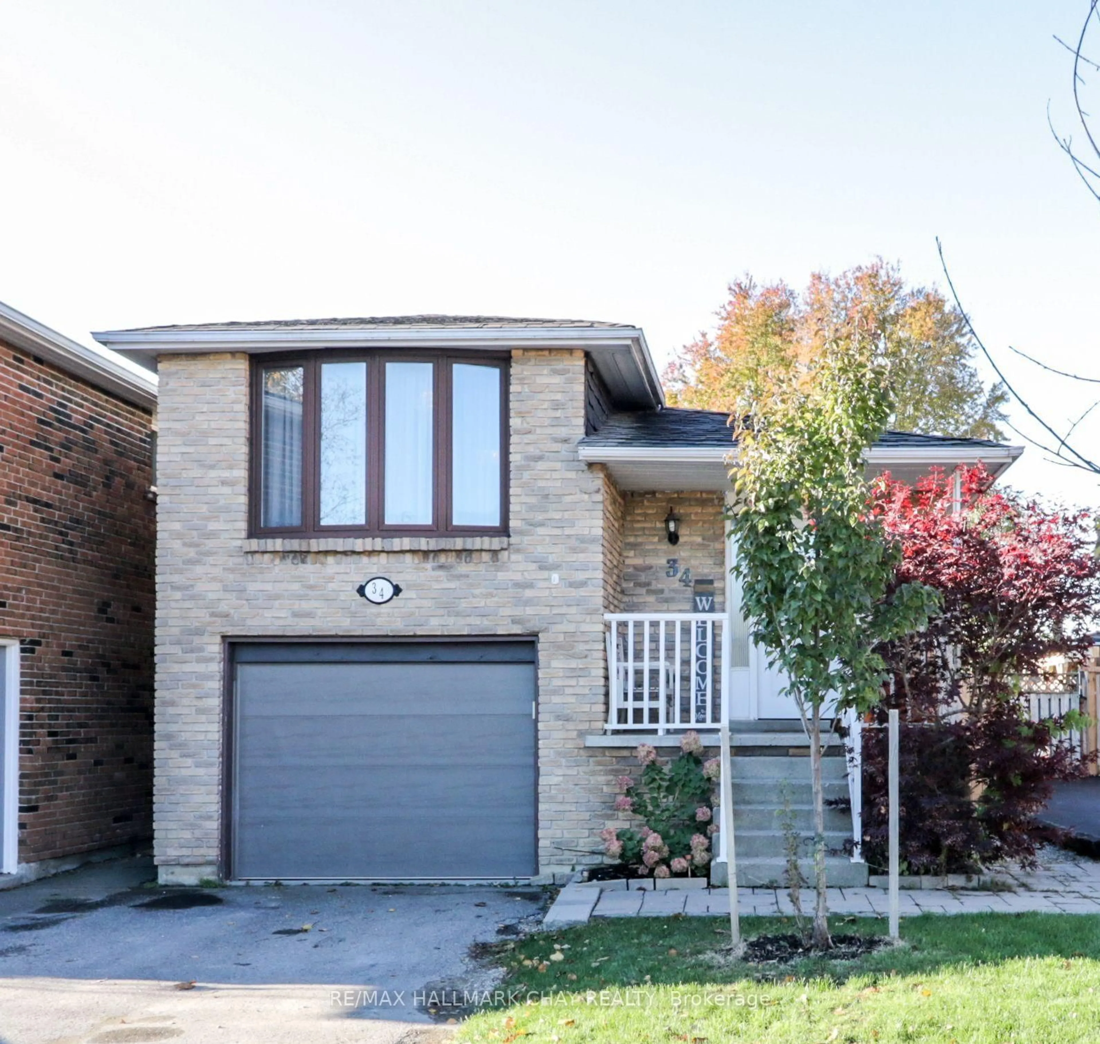 Home with brick exterior material, street for 34 Martin St, Bradford West Gwillimbury Ontario L3Z 1Z5