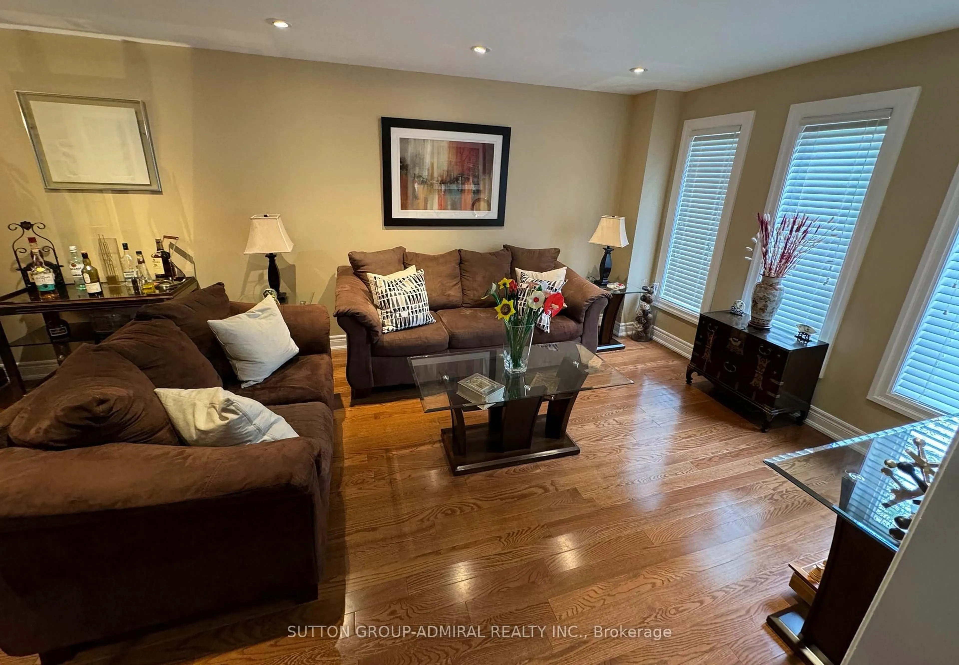 Living room with furniture, wood/laminate floor for 148 Mountbatten Rd, Vaughan Ontario L4J 7W2