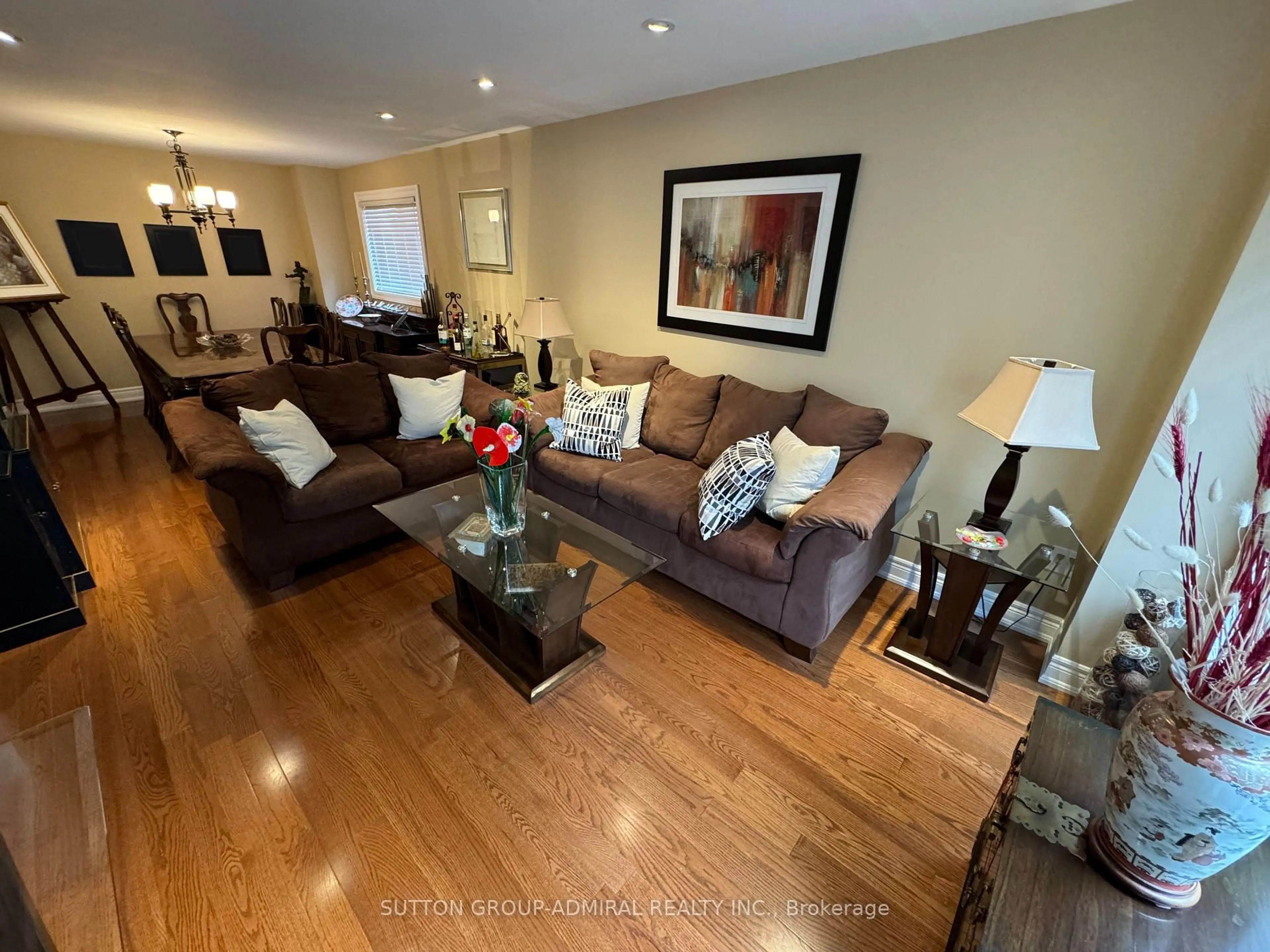 Living room with furniture, wood/laminate floor for 148 Mountbatten Rd, Vaughan Ontario L4J 7W2