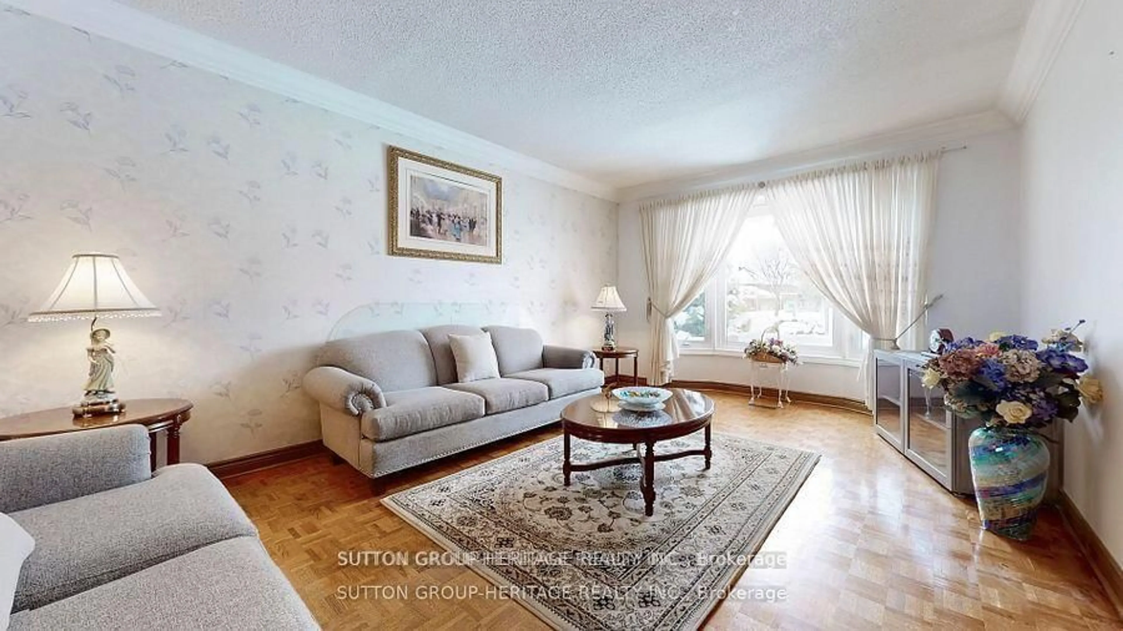 Living room with furniture, wood/laminate floor for 25 Jimston Dr, Markham Ontario L3R 6S1