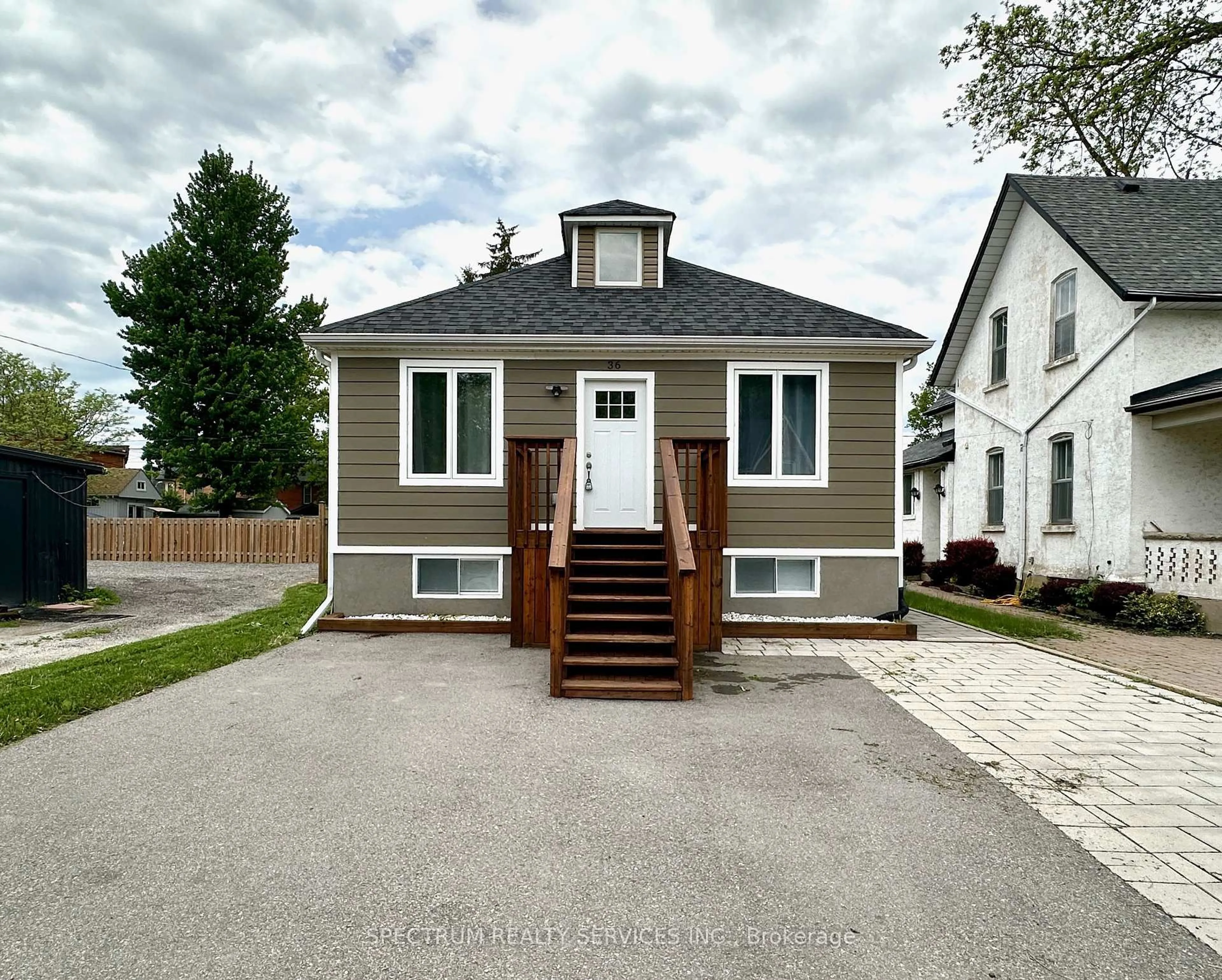 Home with vinyl exterior material, street for 36 Queen St, New Tecumseth Ontario L0G 1W0