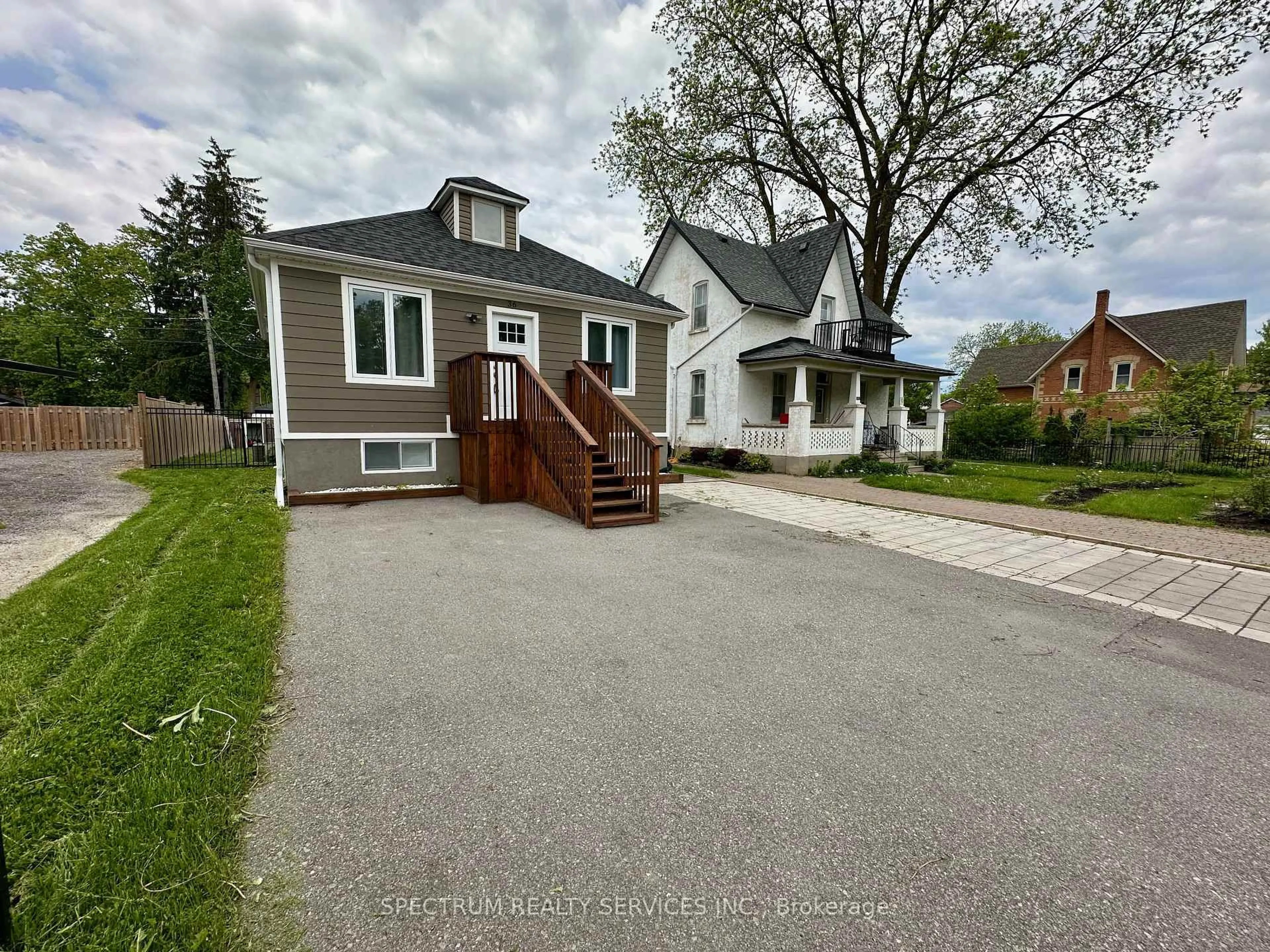 A pic from outside/outdoor area/front of a property/back of a property/a pic from drone, street for 36 Queen St, New Tecumseth Ontario L0G 1W0