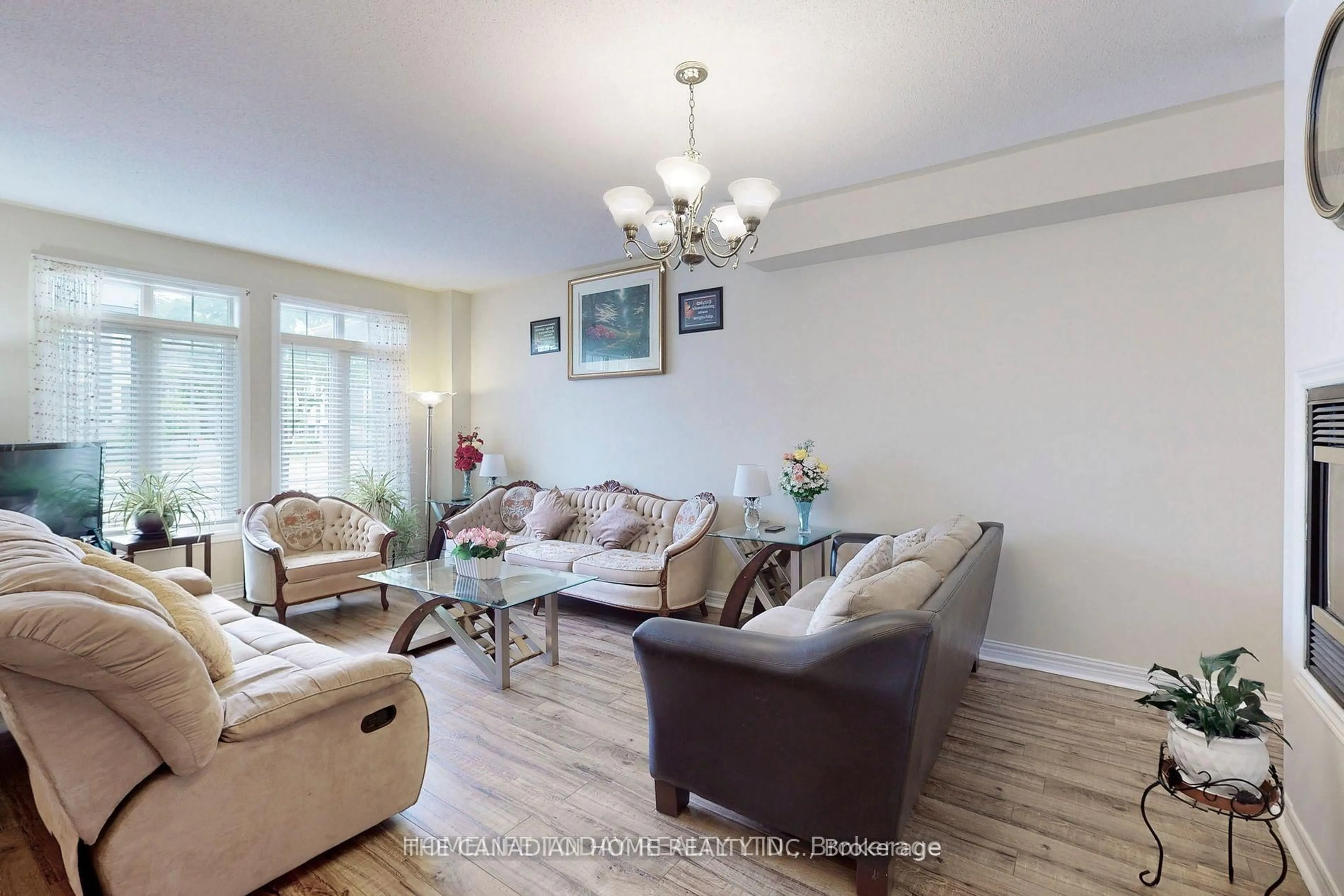 Living room with furniture, wood/laminate floor for 10559 Bayview Ave, Richmond Hill Ontario L4C 0M8