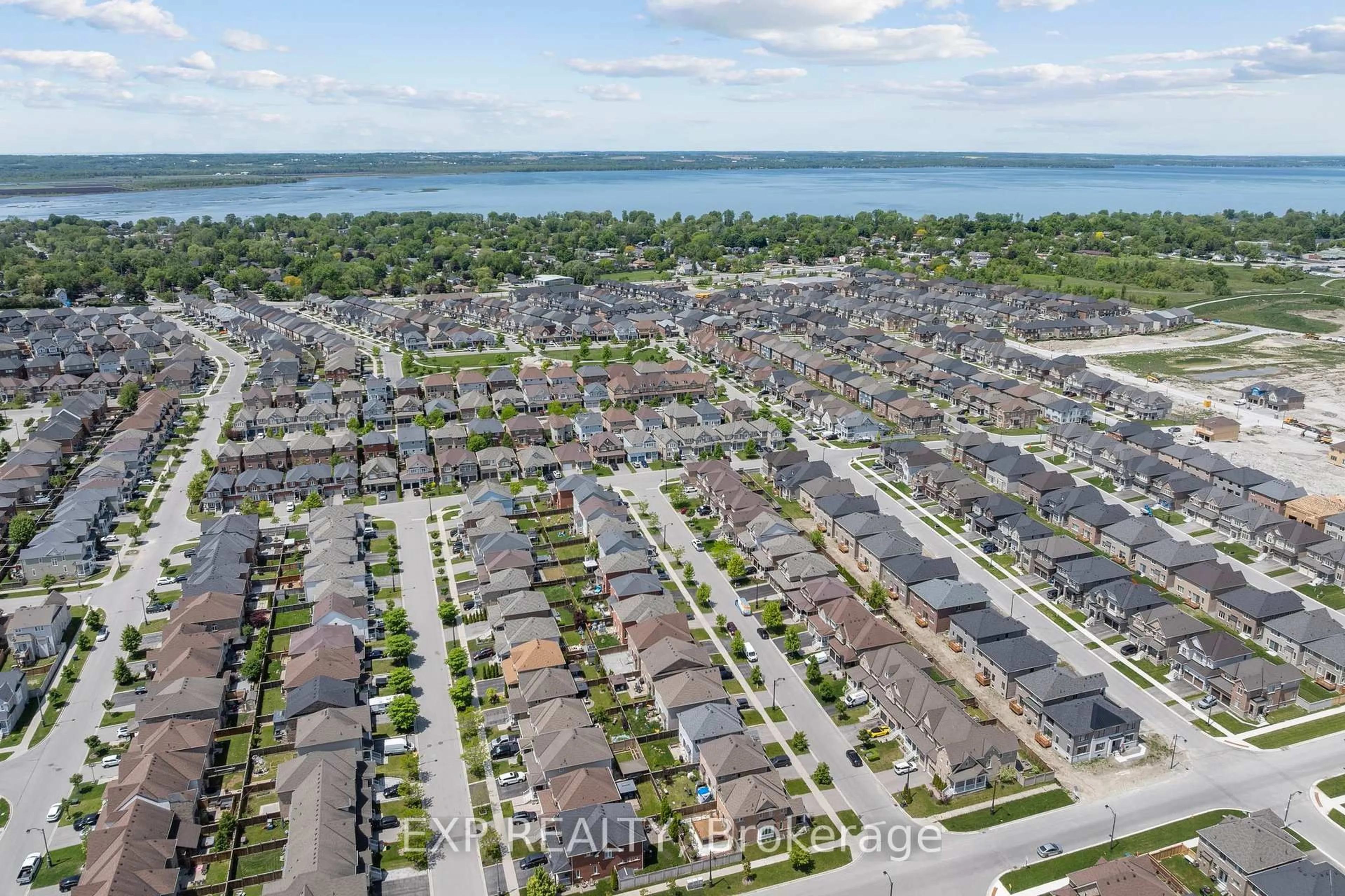 A pic from outside/outdoor area/front of a property/back of a property/a pic from drone, water/lake/river/ocean view for 15 Grey Wing Ave, Georgina Ontario L4P 0E8