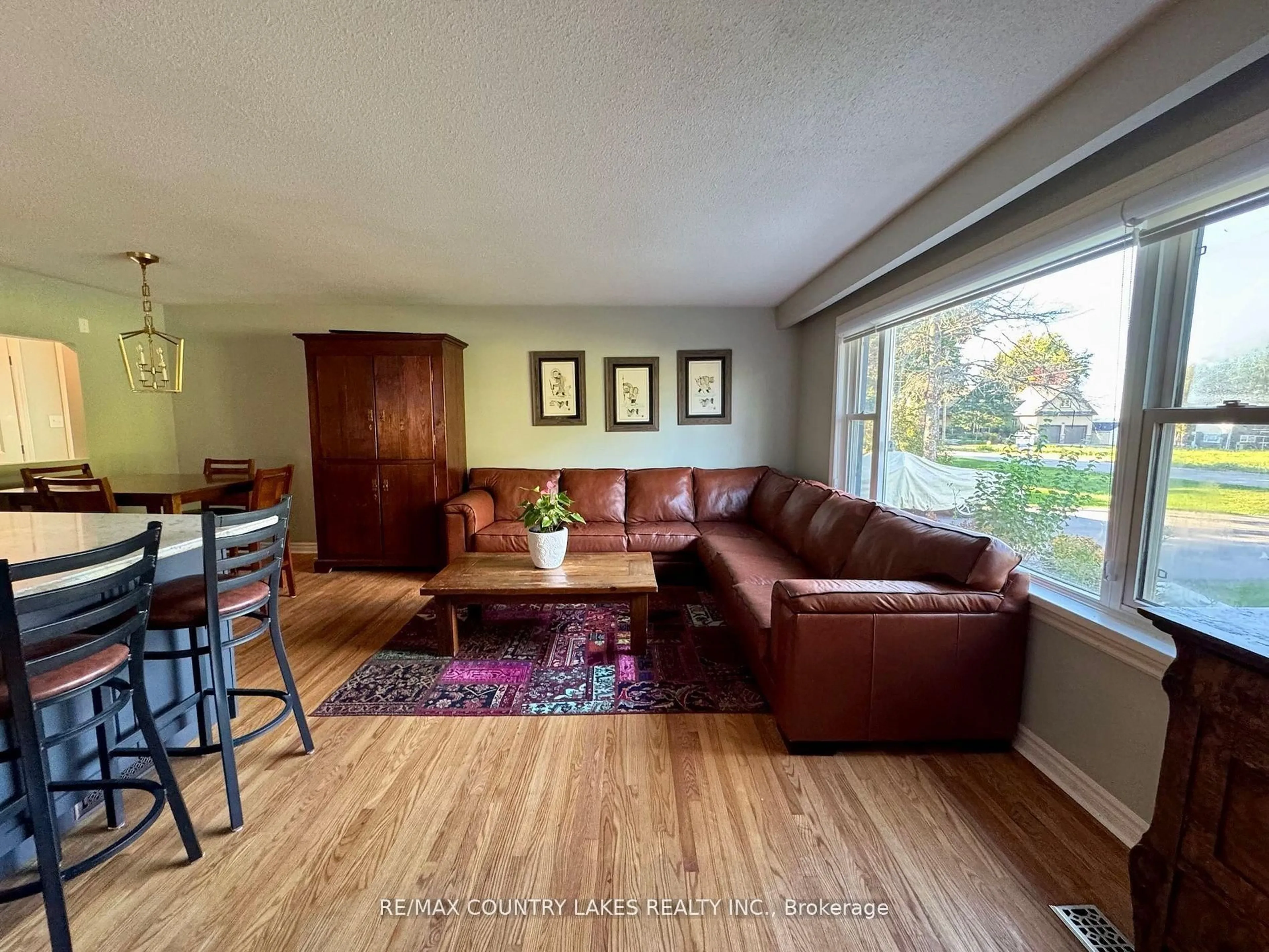 Living room with furniture, wood/laminate floor for 59 Third St, Brock Ontario L0K 1A0
