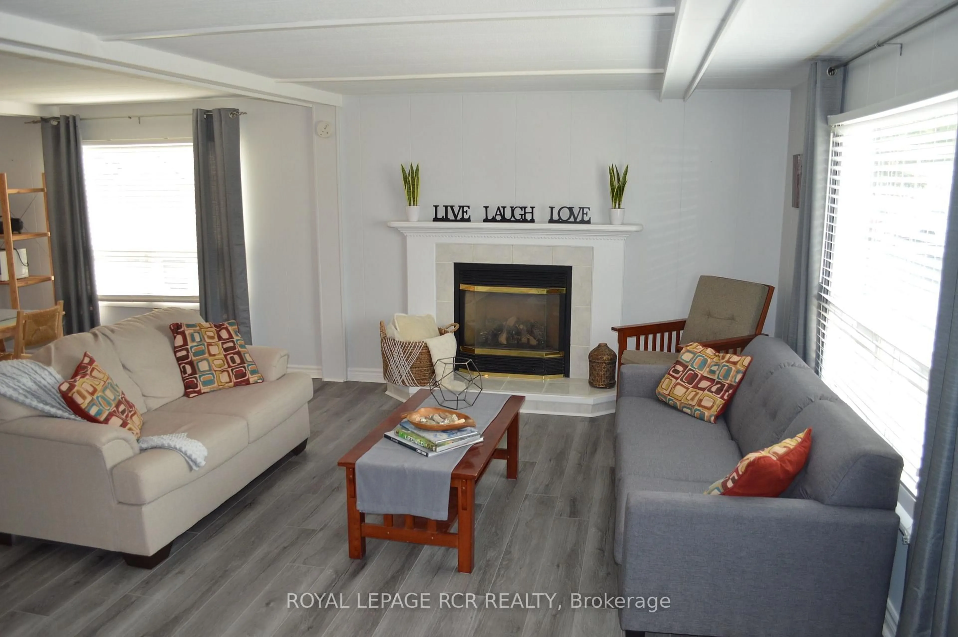 Living room with furniture, wood/laminate floor for 4 Linden Lane, Innisfil Ontario L9S 1P4