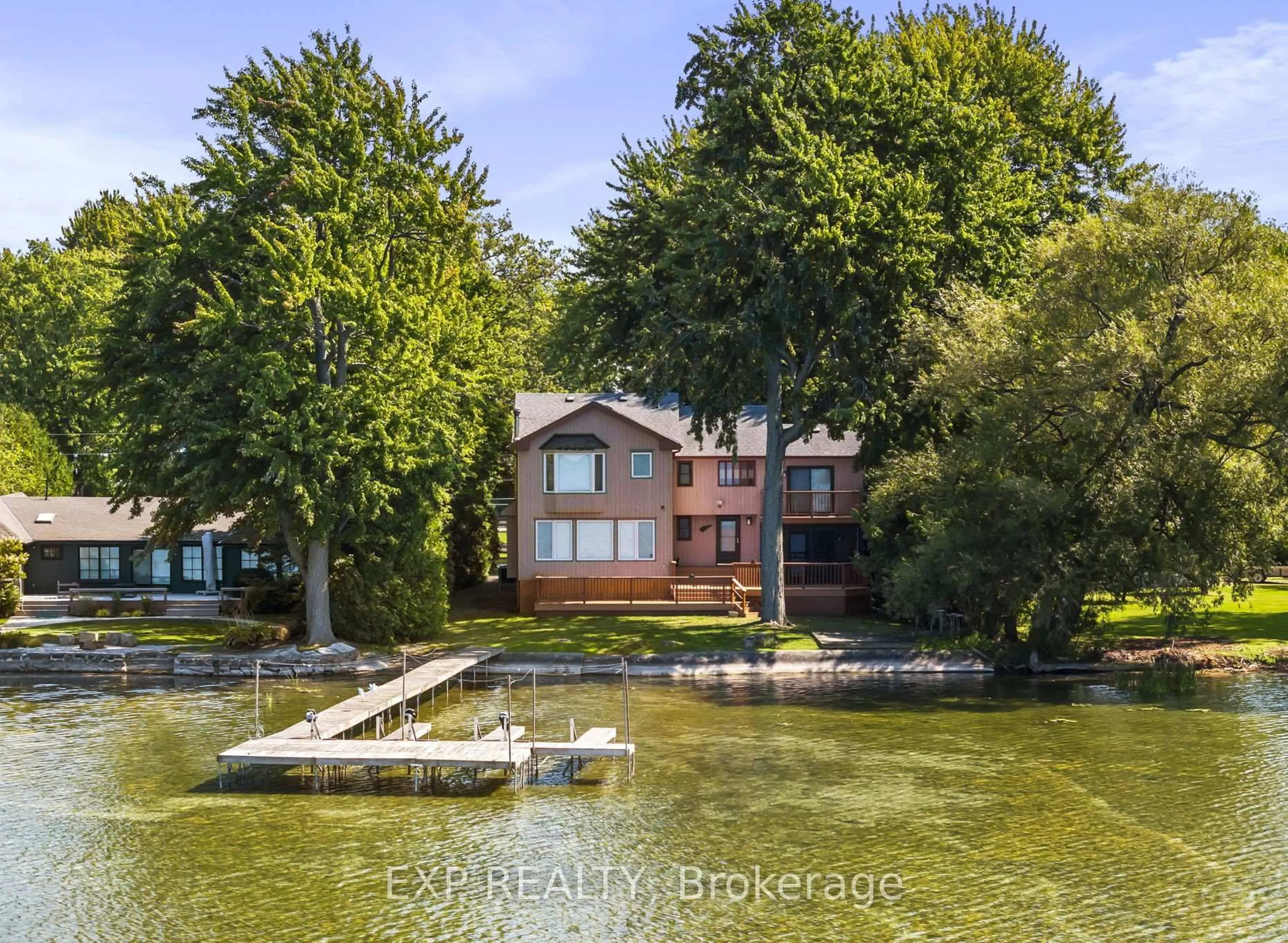 A pic from outside/outdoor area/front of a property/back of a property/a pic from drone, water/lake/river/ocean view for 582 Duclos Point Rd, Georgina Ontario L0E 1N0