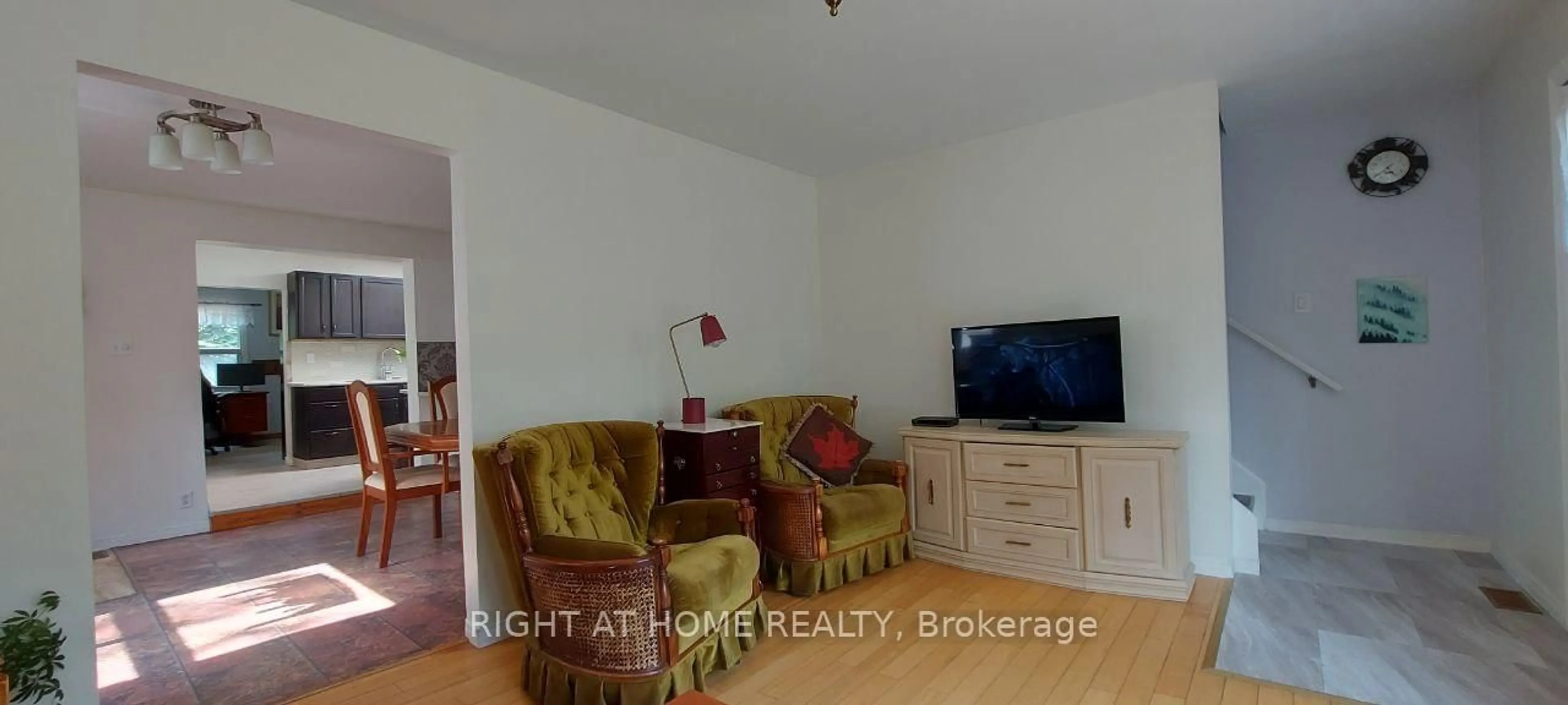 Living room with furniture, wood/laminate floor for 755 Happy Vale Dr, Innisfil Ontario L9S 2E5