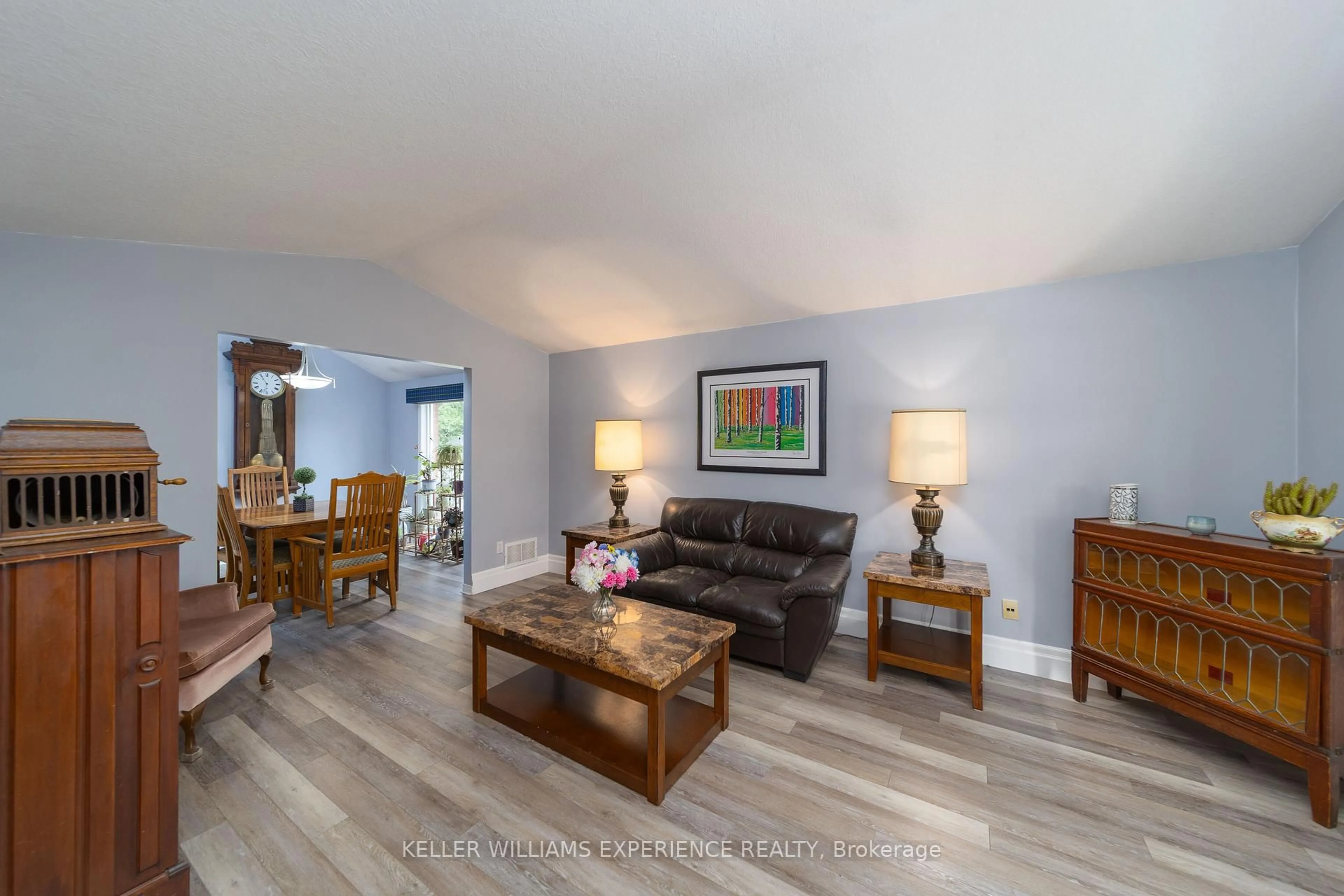 Living room with furniture, wood/laminate floor for 137 Queen St, New Tecumseth Ontario L9R 1K4