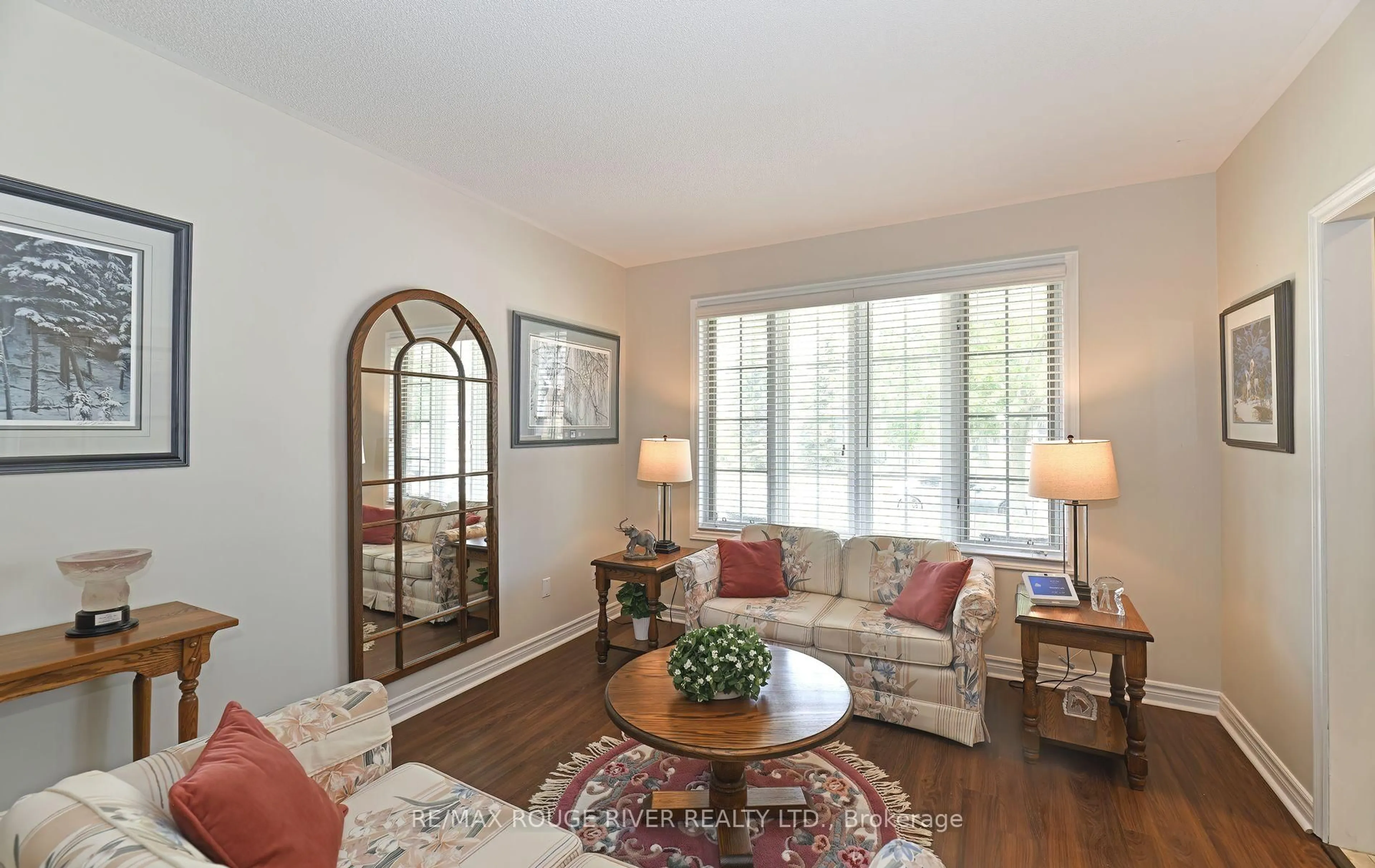 Living room with furniture, wood/laminate floor for 48 Enzo Cres, Uxbridge Ontario L9P 1M1