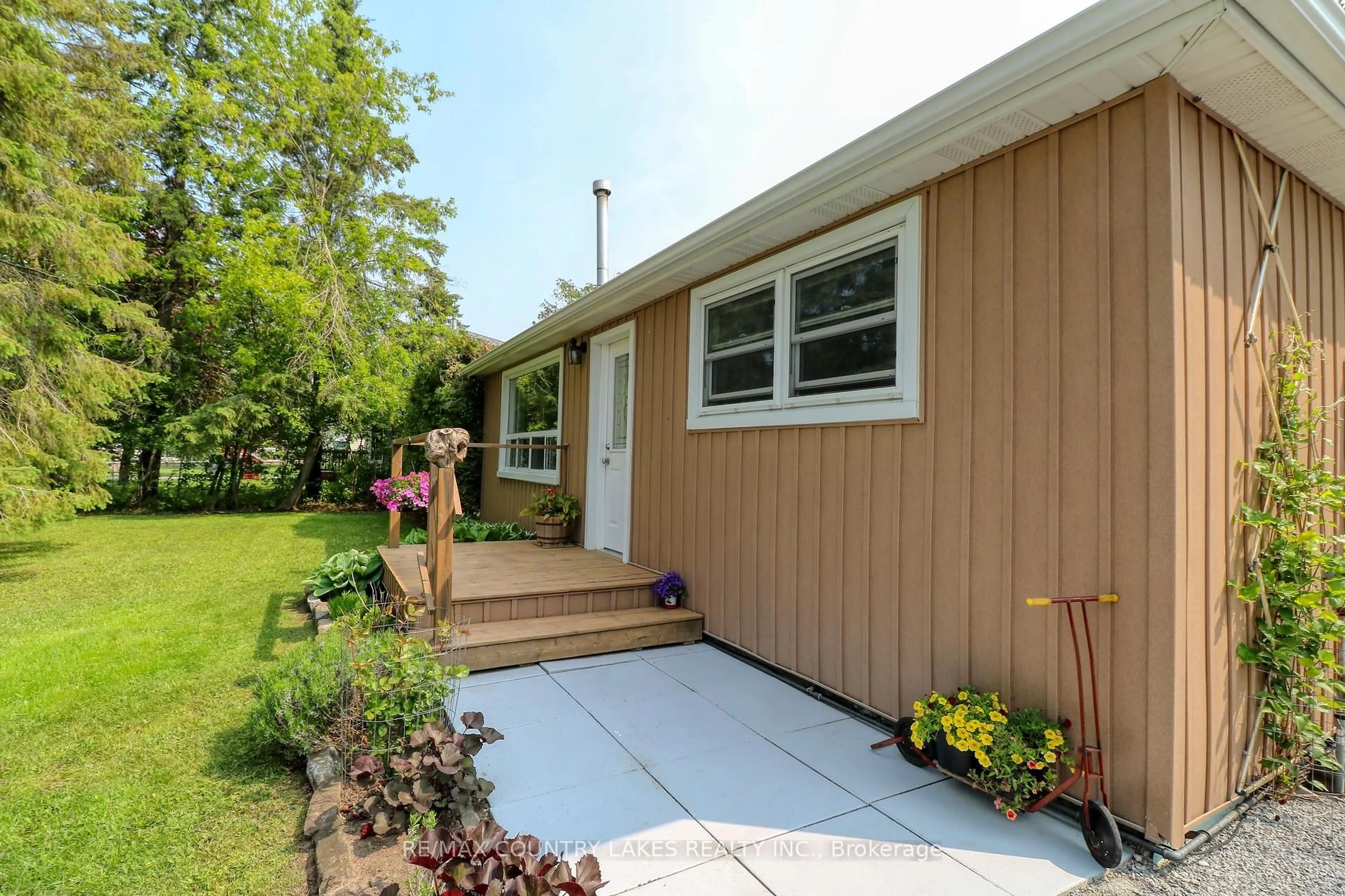 Home with vinyl exterior material, street for 15 Nancy Ave, Brock Ontario L0K 1A0