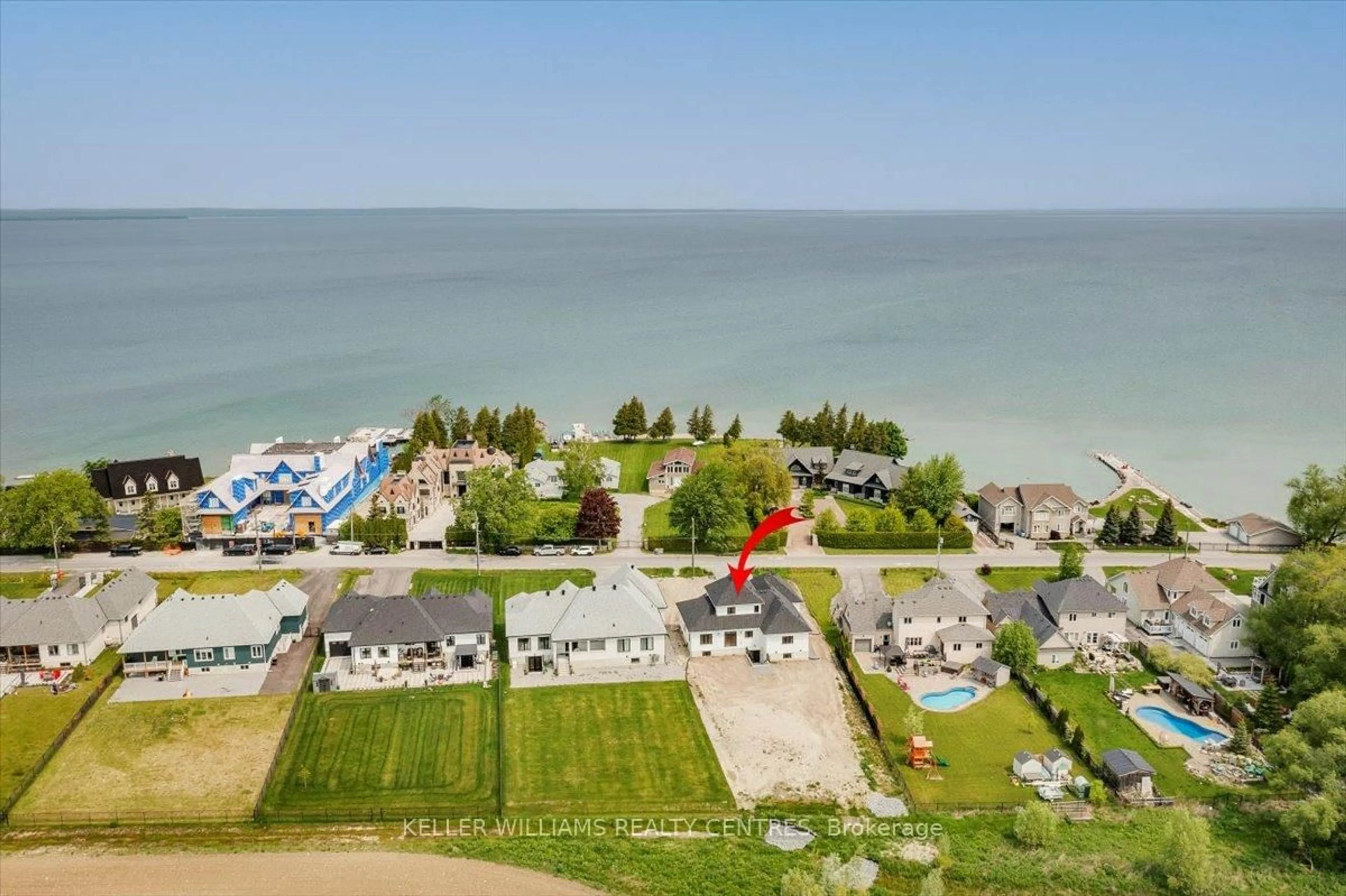 A pic from outside/outdoor area/front of a property/back of a property/a pic from drone, water/lake/river/ocean view for 147 Lake Dr, Georgina Ontario L4P 0S7