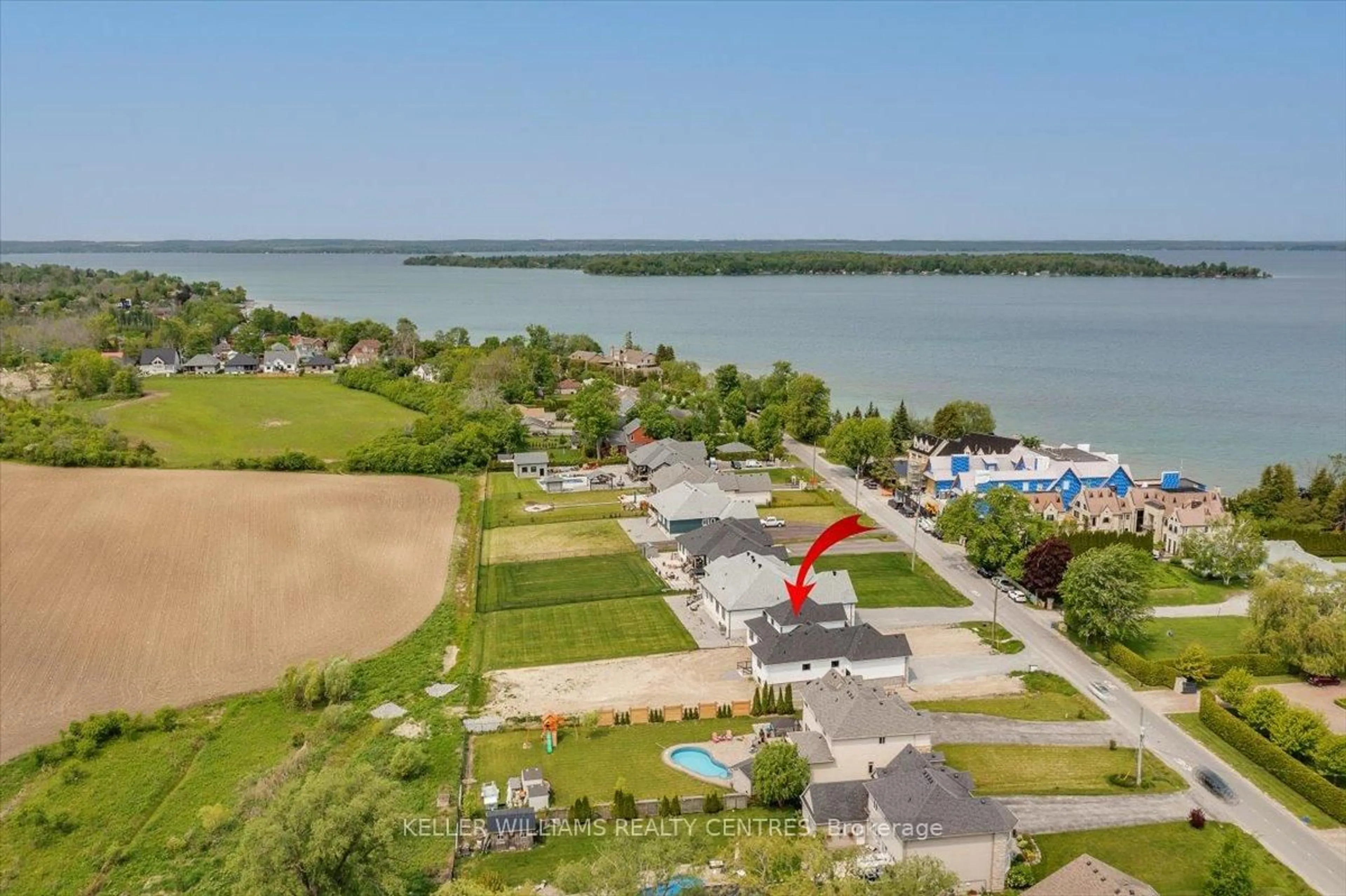 A pic from outside/outdoor area/front of a property/back of a property/a pic from drone, water/lake/river/ocean view for 147 Lake Dr, Georgina Ontario L4P 0S7