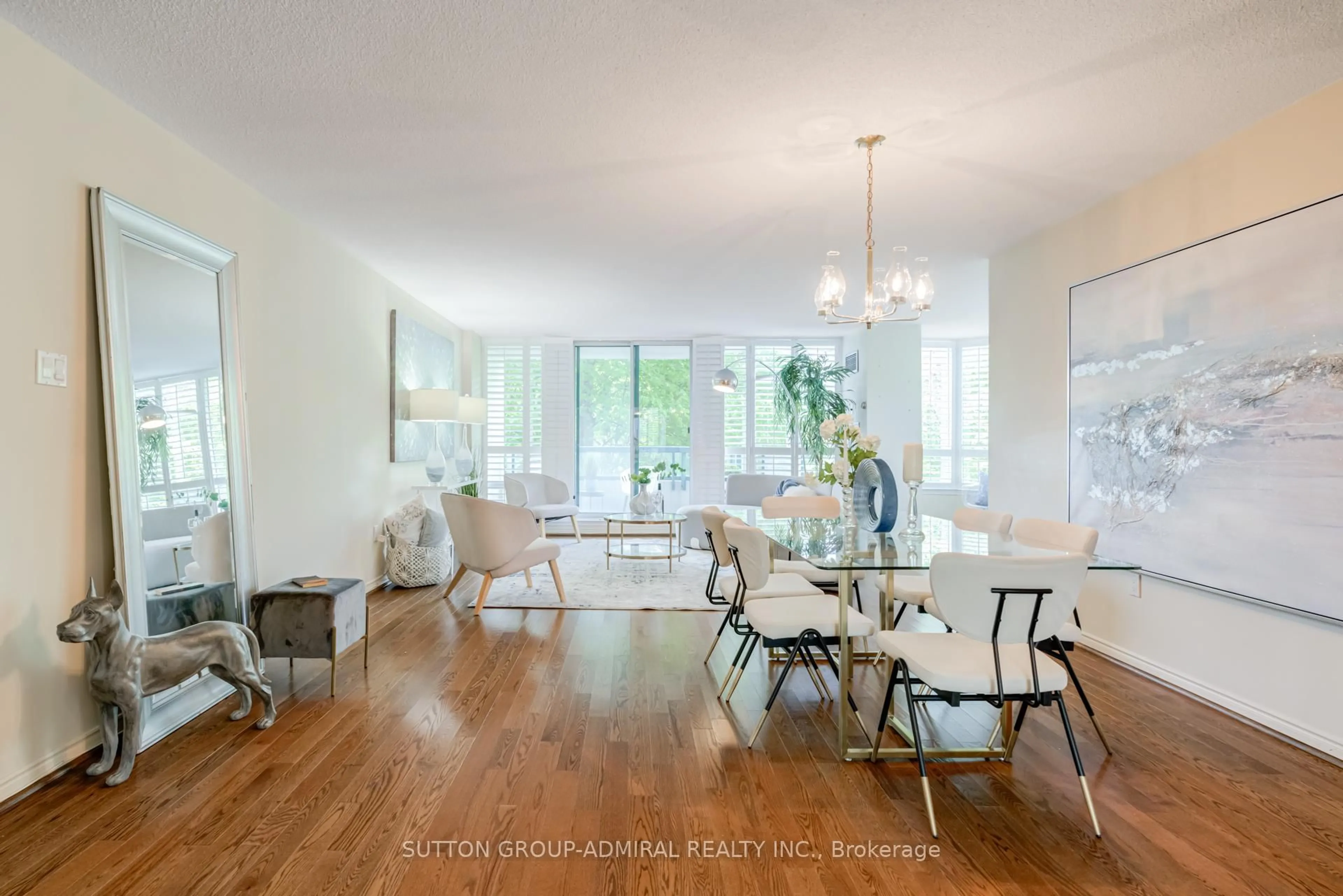 Living room with furniture, wood/laminate floor for 7250 Yonge St #311, Vaughan Ontario L4J 7X1