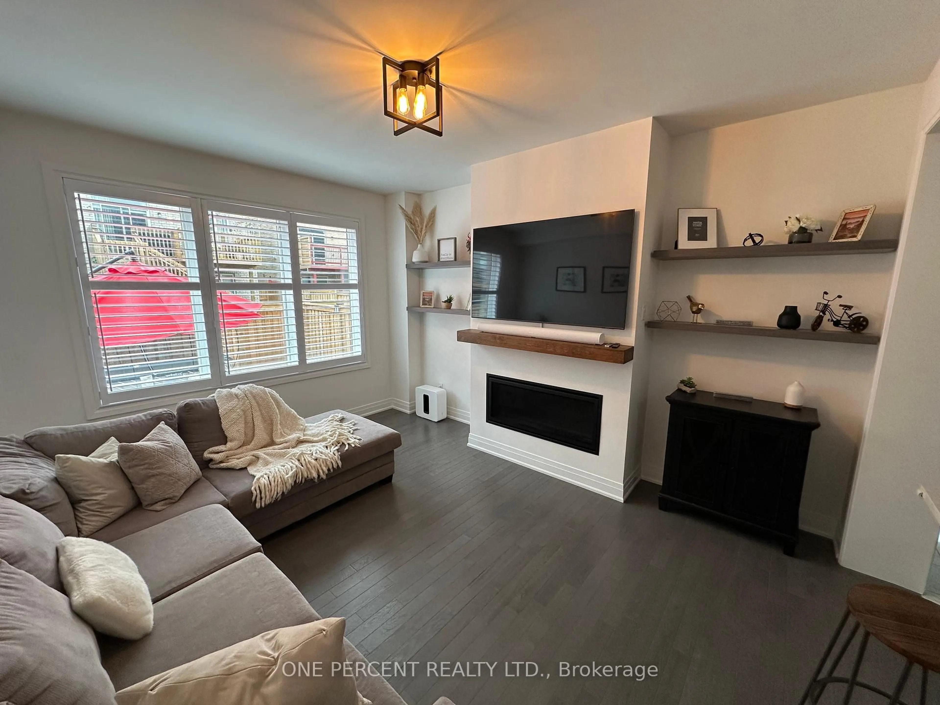 Living room with furniture, wood/laminate floor for 15 Richard Boyd Dr, East Gwillimbury Ontario L9N 0S6