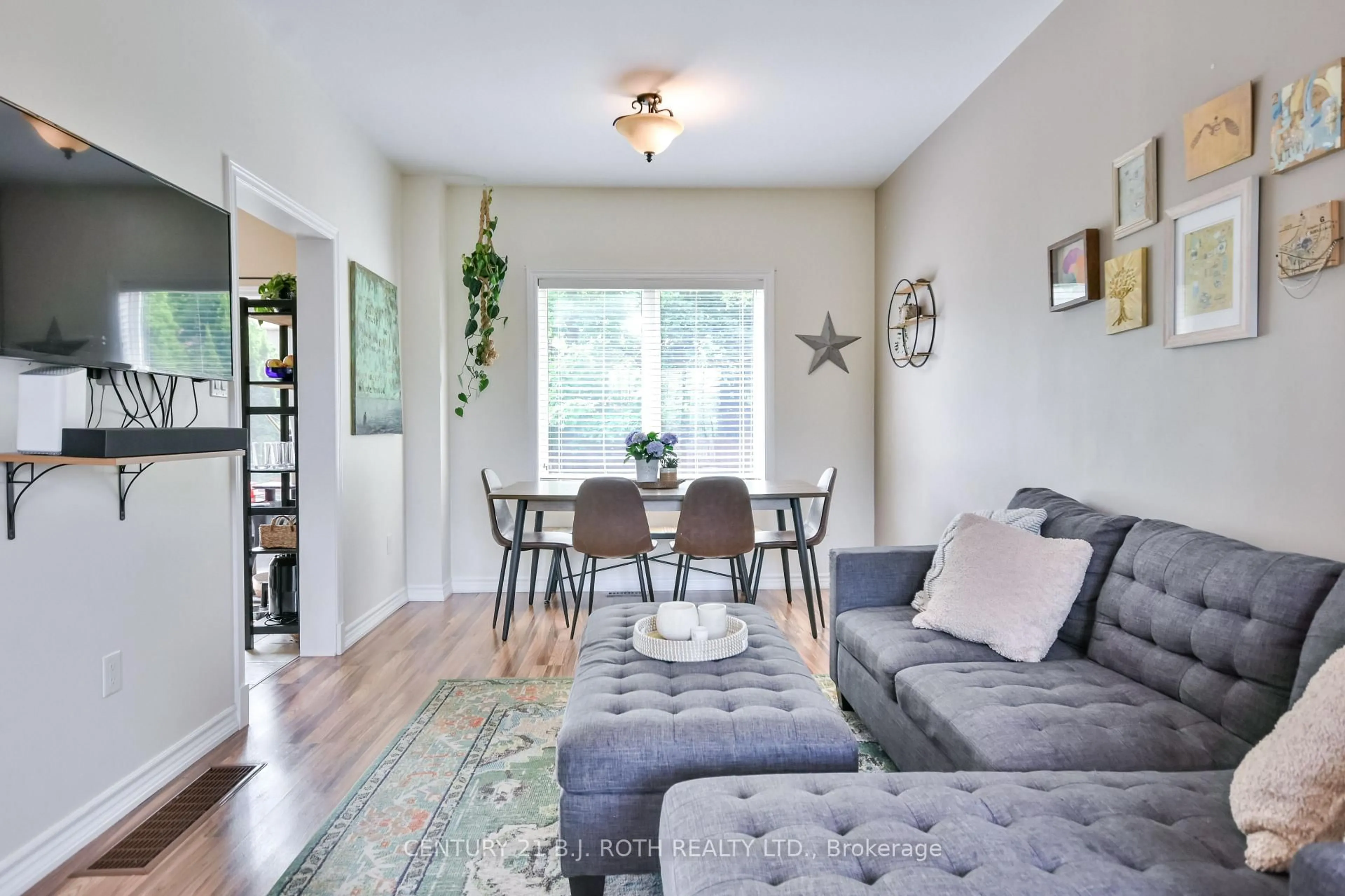 Living room with furniture, wood/laminate floor for 1863 Swan St, Innisfil Ontario L9S 0B2