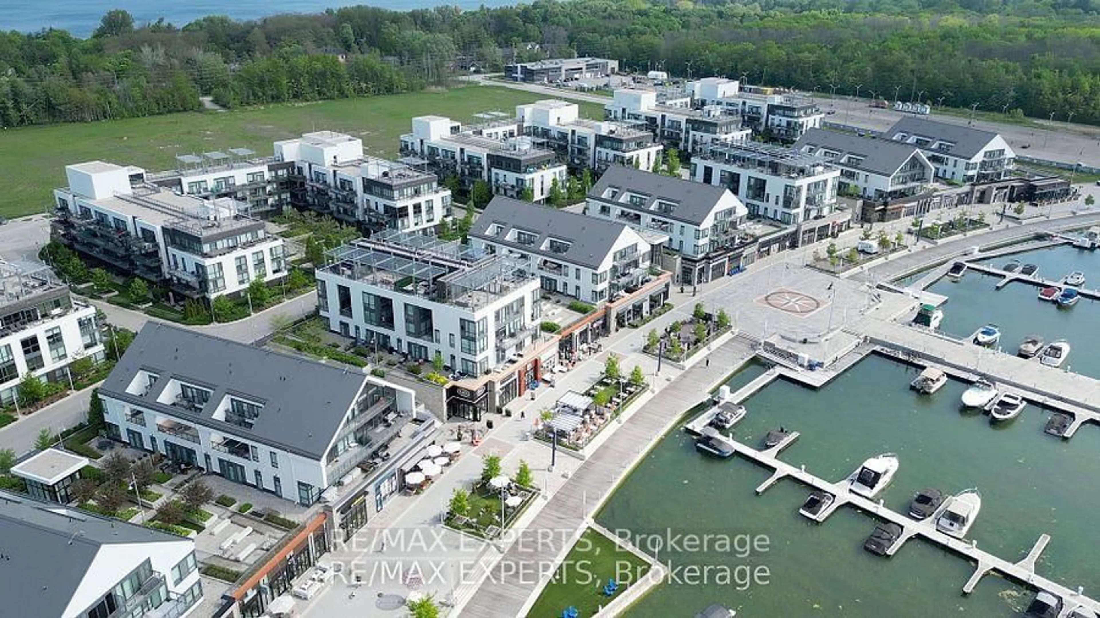 A pic from outside/outdoor area/front of a property/back of a property/a pic from drone, water/lake/river/ocean view for 301 Sea Ray Ave #C113, Innisfil Ontario L9S 2P7