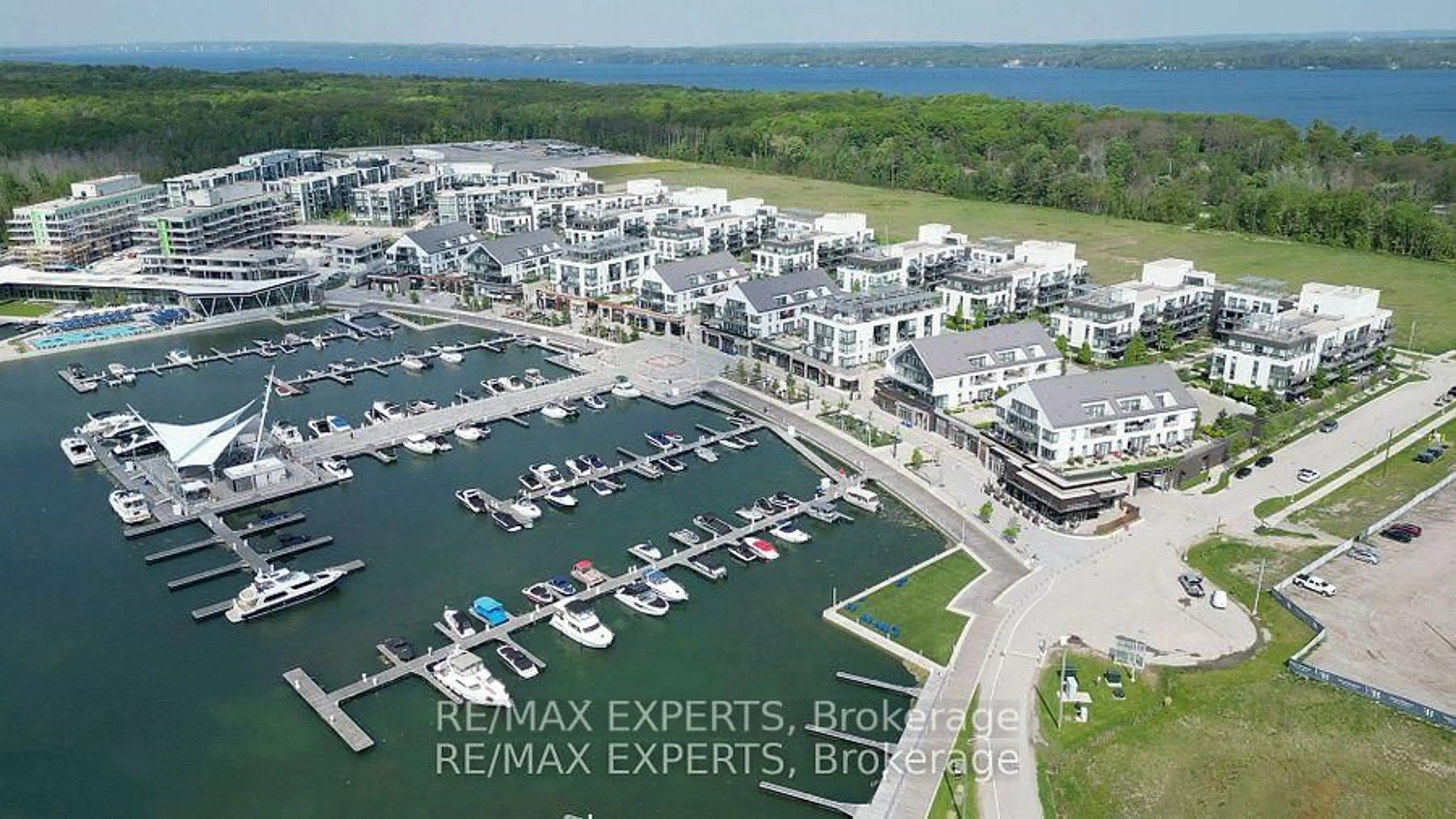 A pic from outside/outdoor area/front of a property/back of a property/a pic from drone, water/lake/river/ocean view for 301 Sea Ray Ave #C113, Innisfil Ontario L9S 2P7