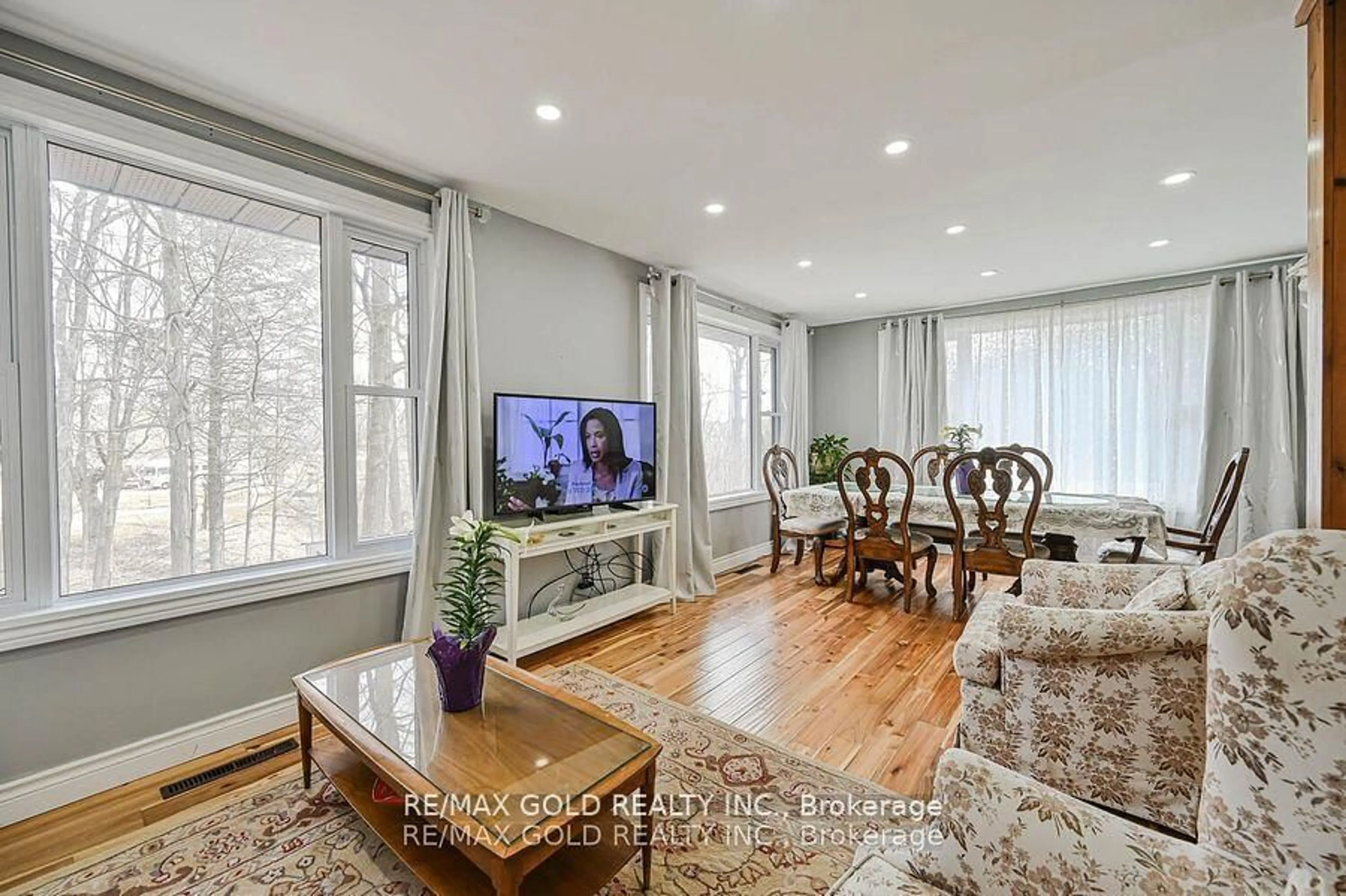 Living room with furniture, wood/laminate floor for 8726 Highway 9, New Tecumseth Ontario L0G 1W0