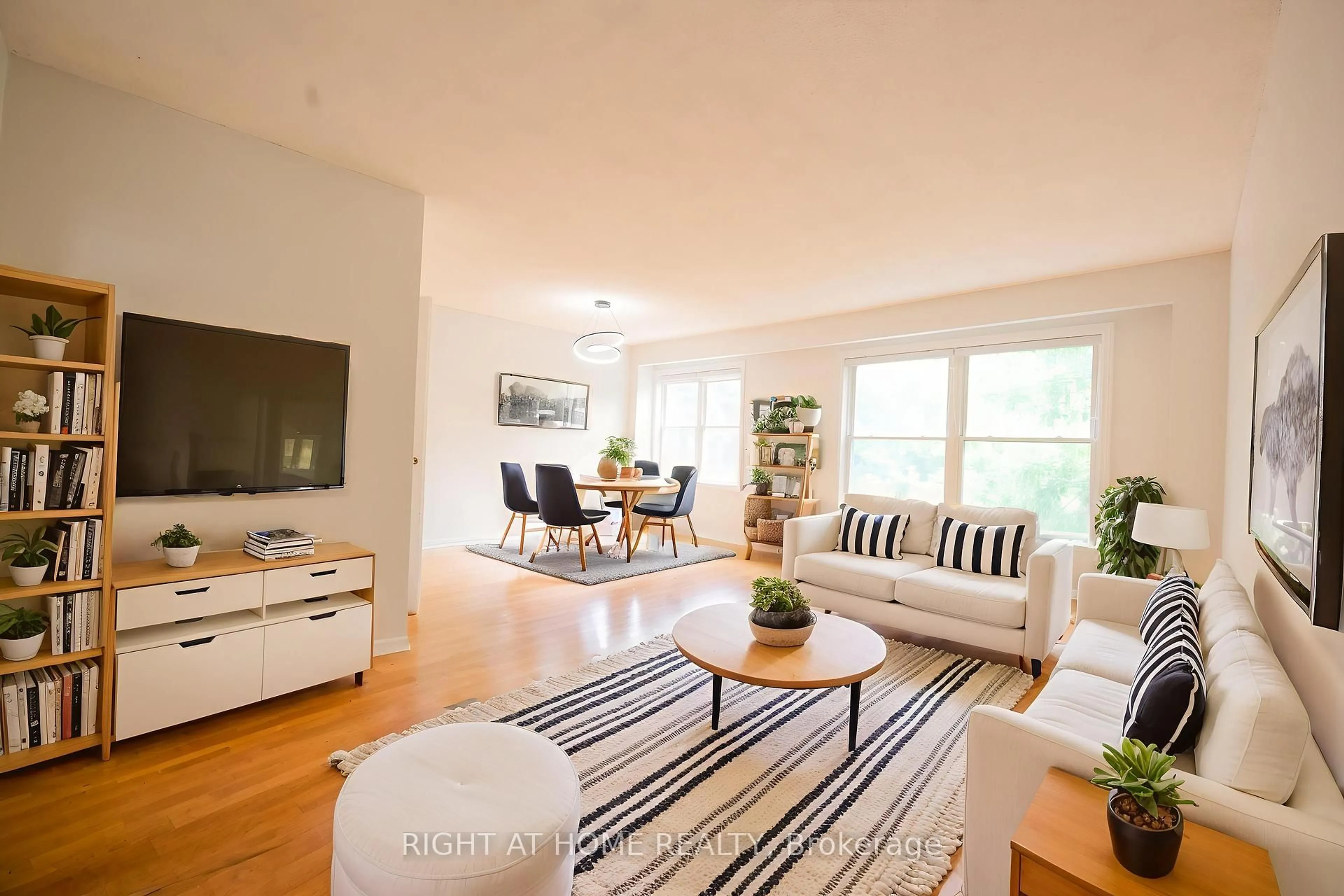 Living room with furniture, wood/laminate floor for 240 Simonston Blvd, Markham Ontario L3T 4T5