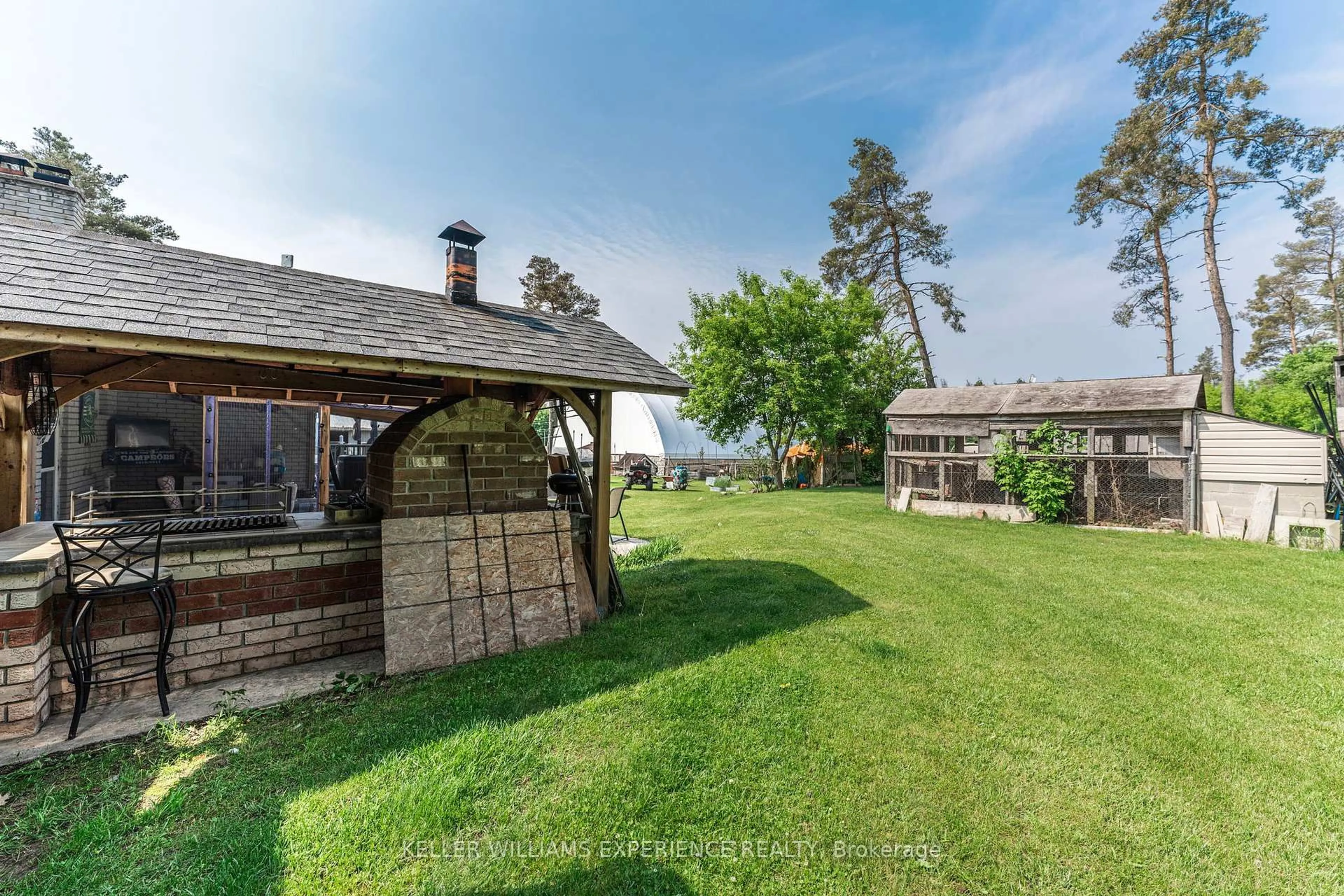 A pic from outside/outdoor area/front of a property/back of a property/a pic from drone, unknown for 7106 County Road 56, Essa Ontario L0M 1T0