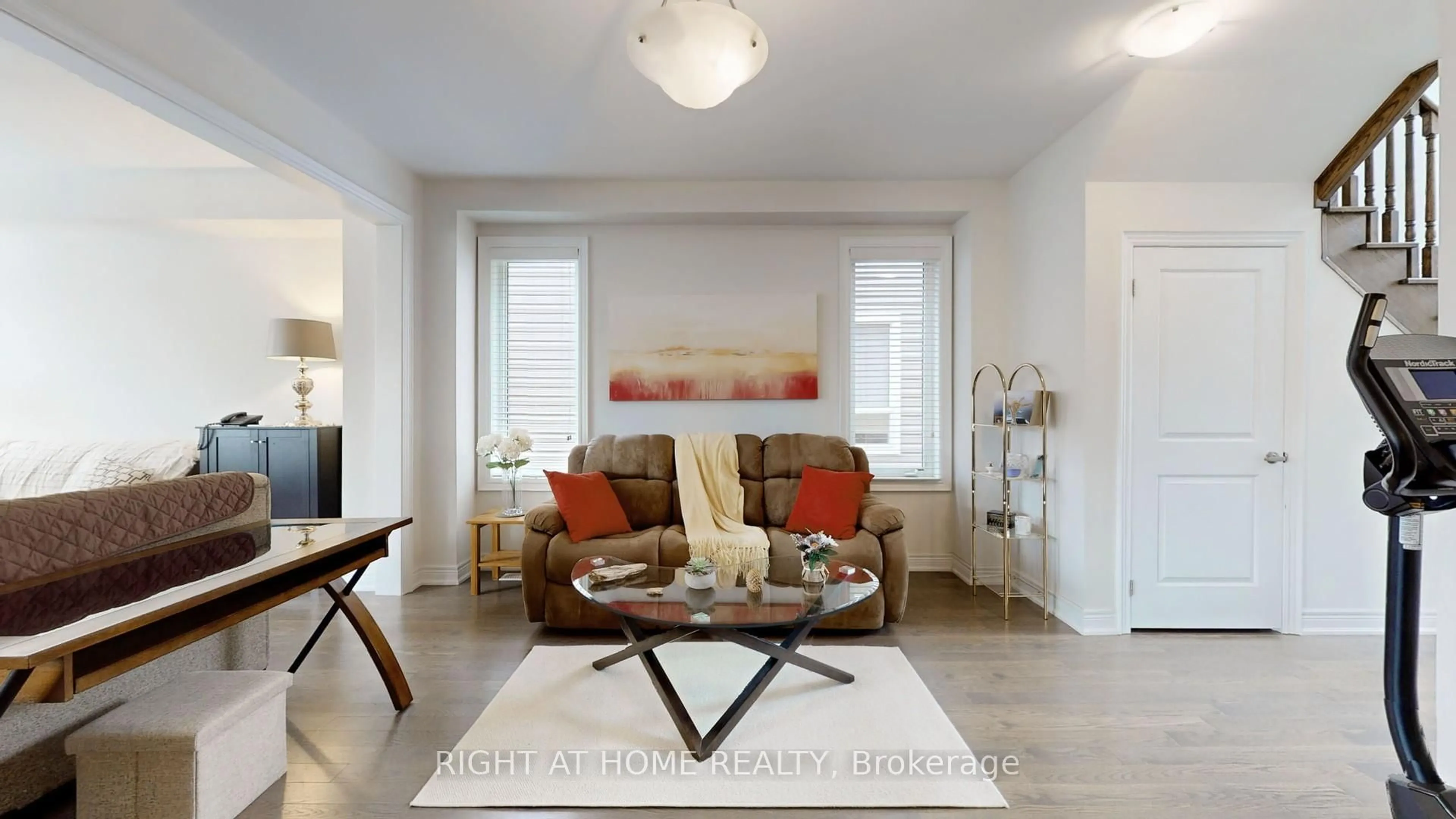 Living room with furniture, wood/laminate floor for 11 Robert Wilson Cres, Georgina Ontario L4P 0G8